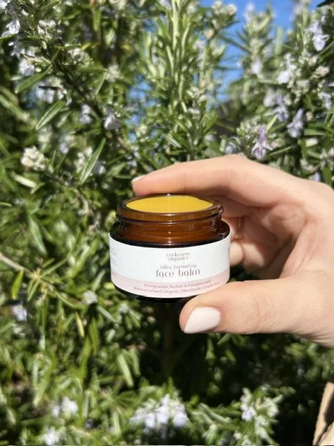 Handmade beeswax face balm by Cuckmere Organics in an amber glass jar