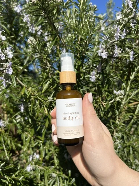 Botanical body oil by Cuckmere Organics in an amber glass bottle