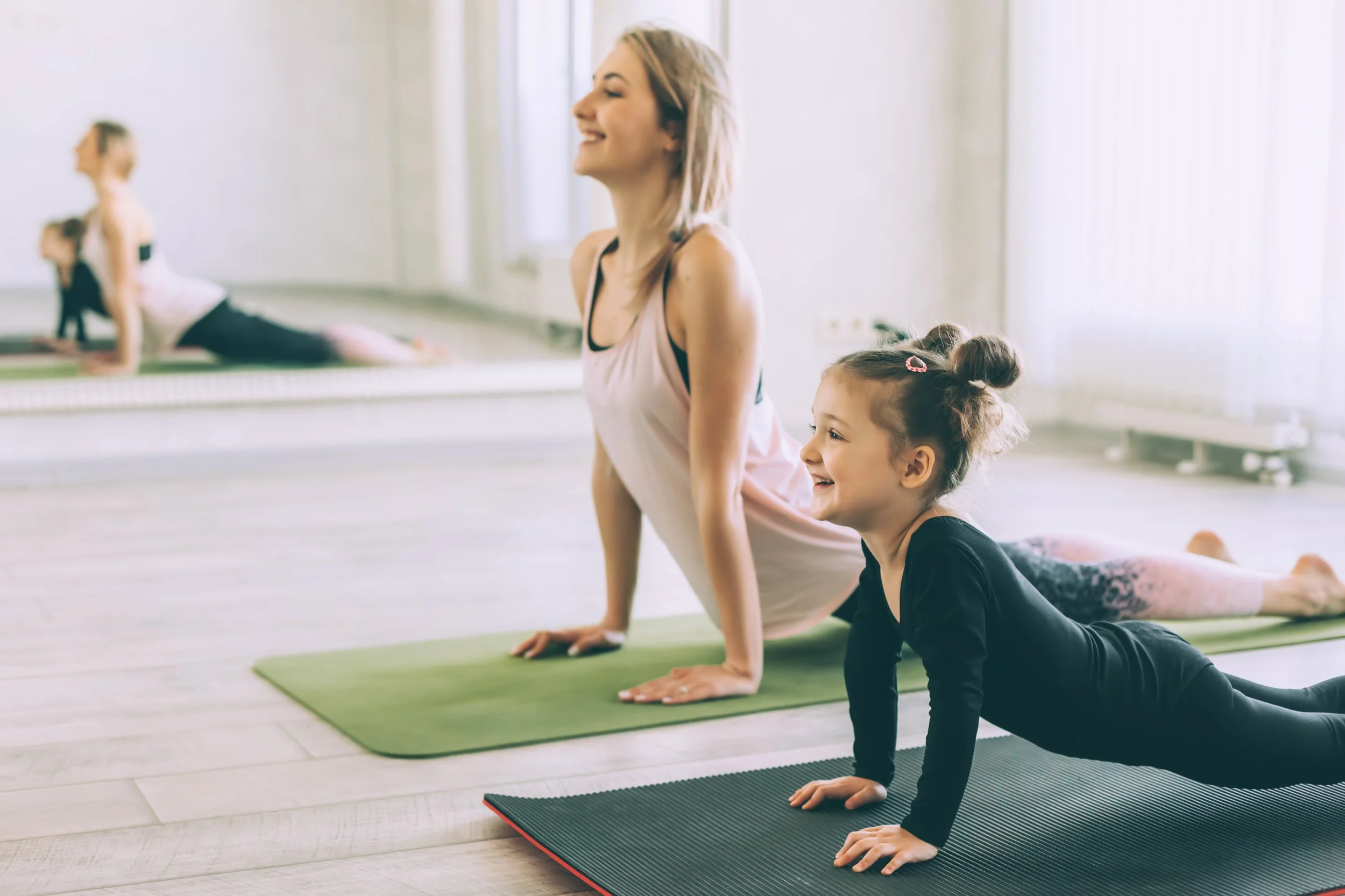Mama and me big-kids yoga focused on bonding, connection and yoga for kids 7-11 years old with their mom or dad. options to add family members. little kids yoga for families focus on kids 3-8 years old. yoga for the whole family