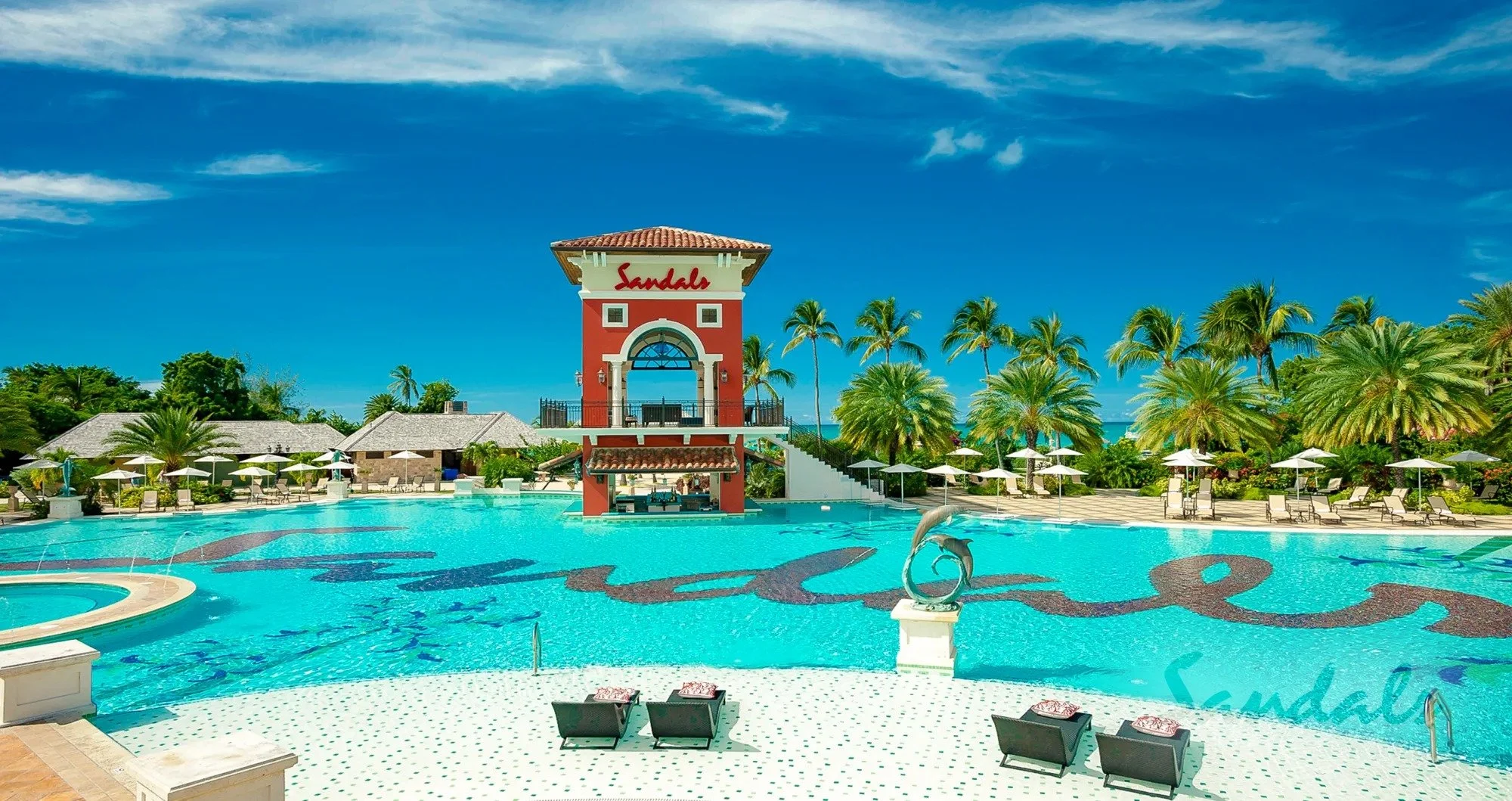 Scenic Antigua resort pool with crystal blue water, nestled among palm trees and inviting lounge chairs_