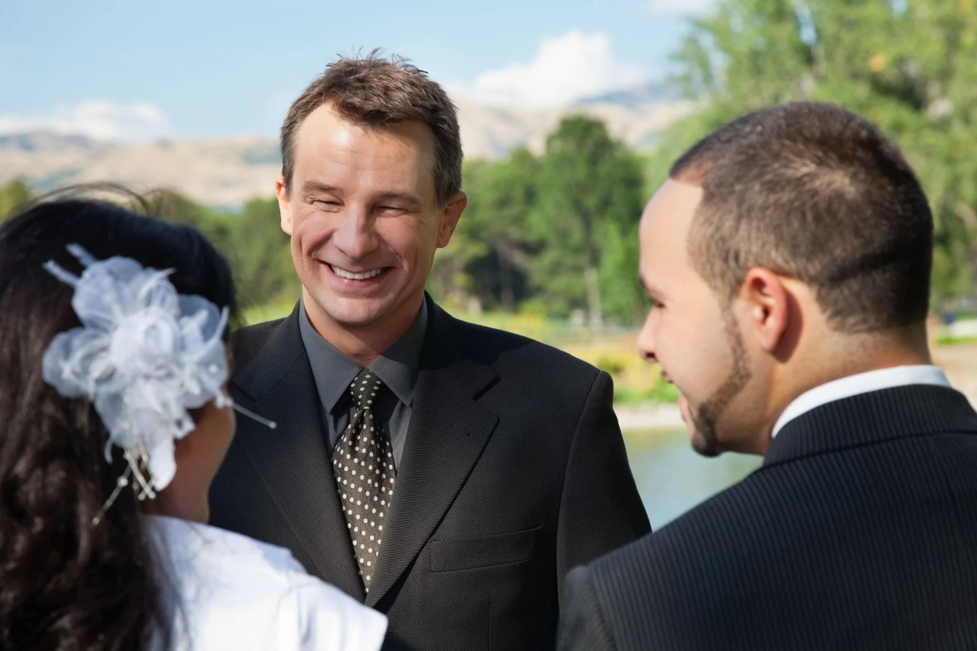 professional-wedding-officiant-smiling-outdoor.jpg
