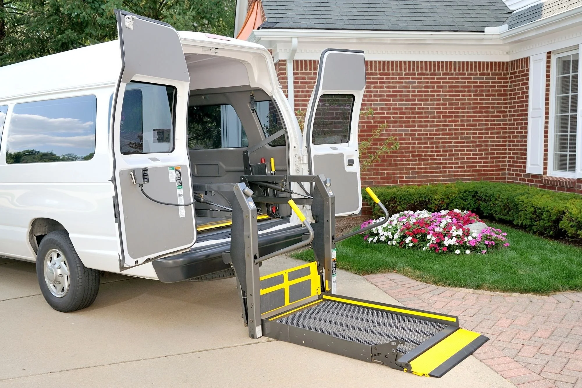 Accessible van with wheelchair ramp extended—ADA-friendly shuttle option for wedding guests and VIPs