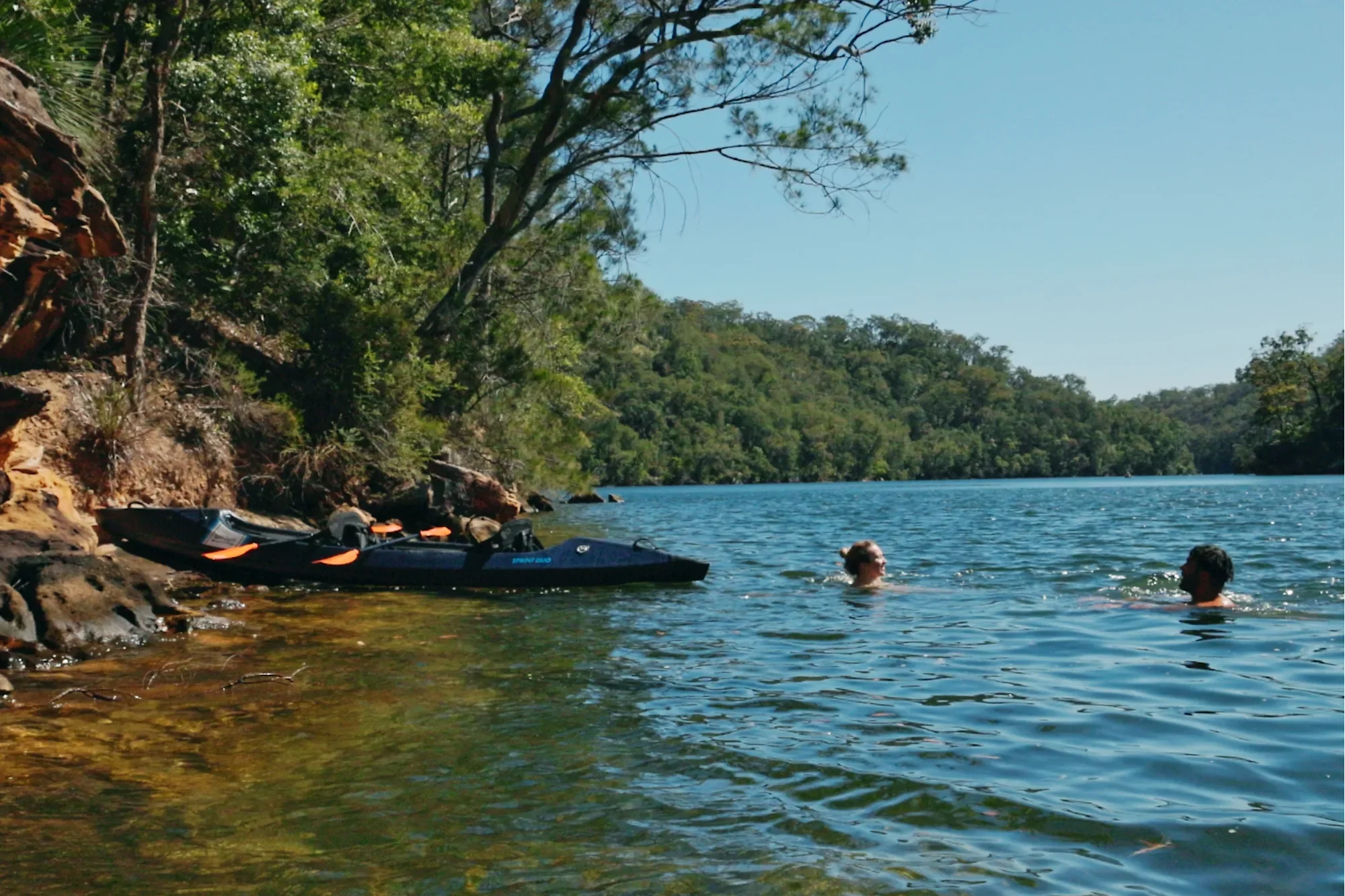 swimming next to kayak