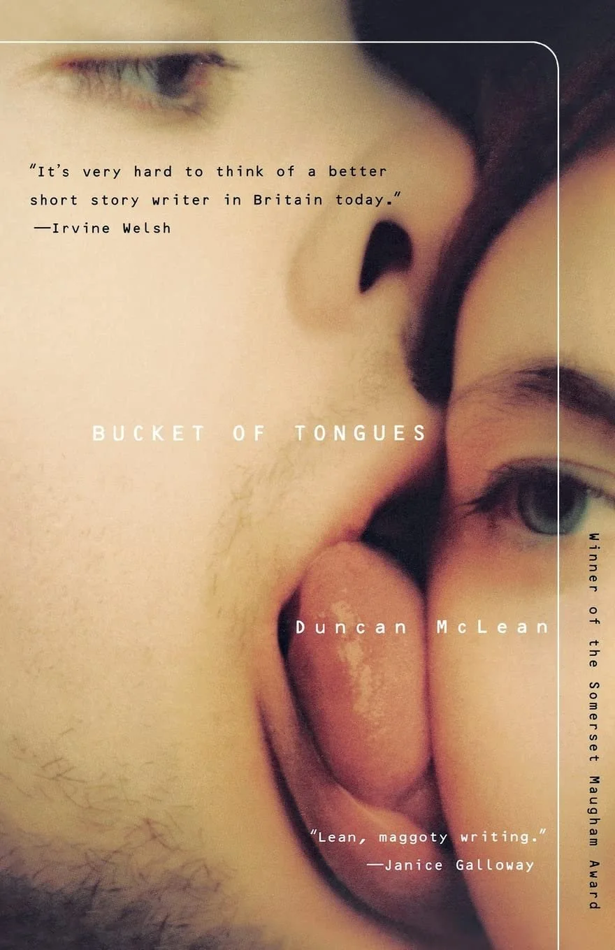 Close-up of two faces, one with an eye visible, the other with an open mouth and tongue out, sharing a kiss.