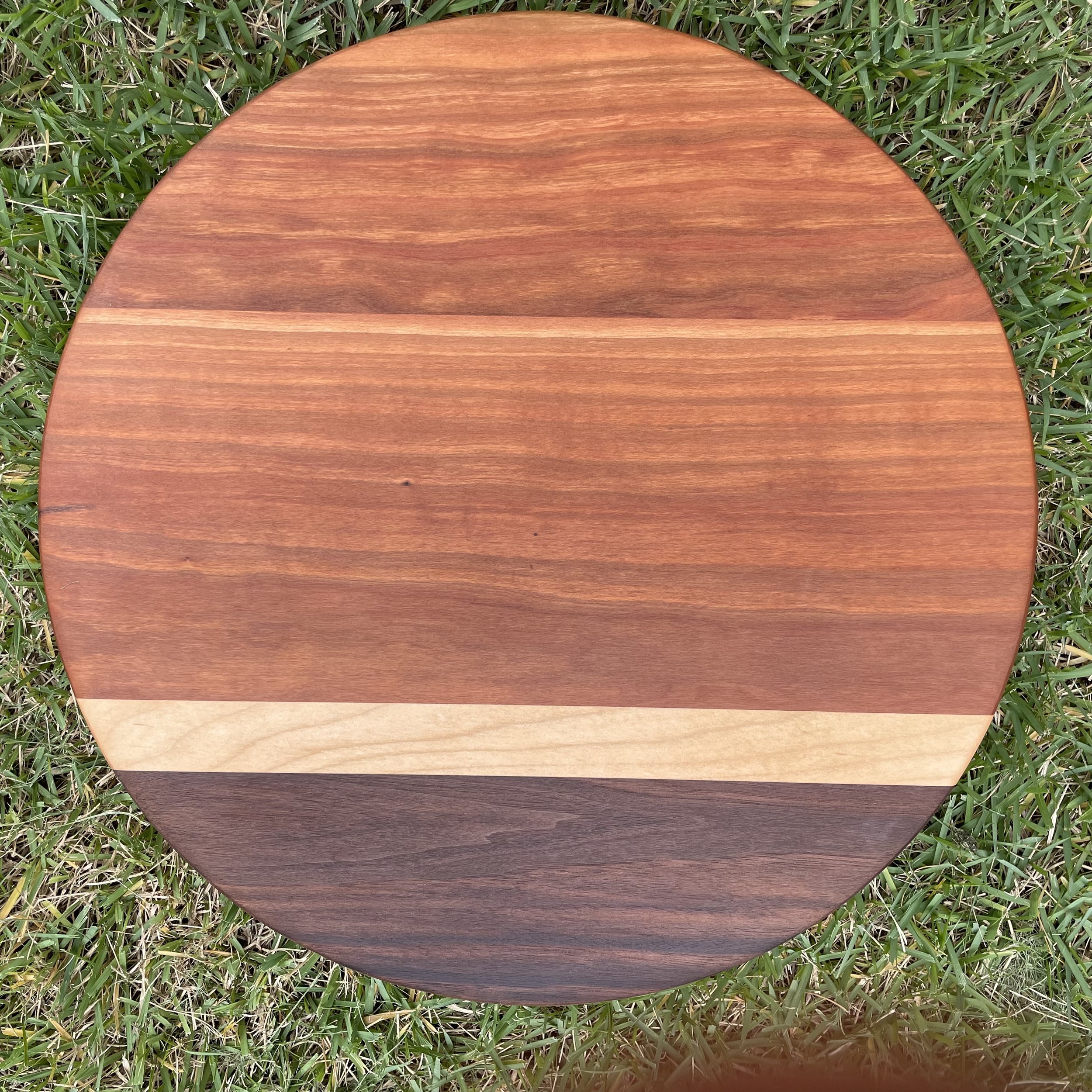 wide cherry hardwood with walnut edge and thin maple stripe
