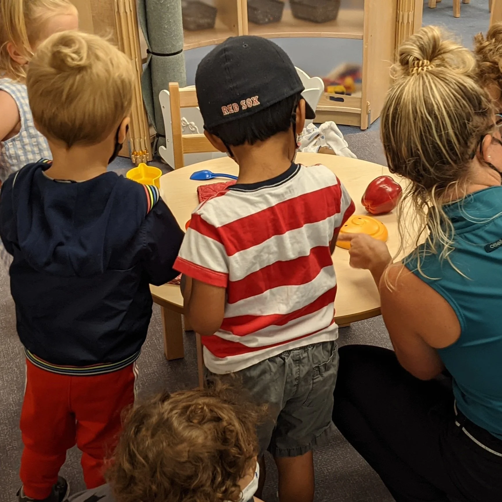 Preschool Teacher with Students and Professional Development App