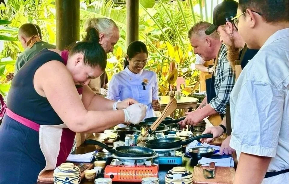 Group of Chefs and people from gastronomy and tourism sector do a hand-on cooking class at Chef Nak