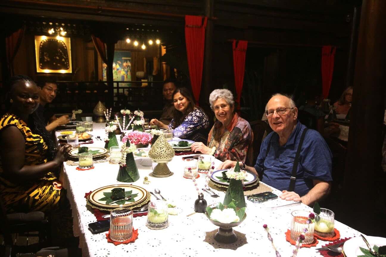 Happy guests at the dining table during Chef Nak’s home dining experience.