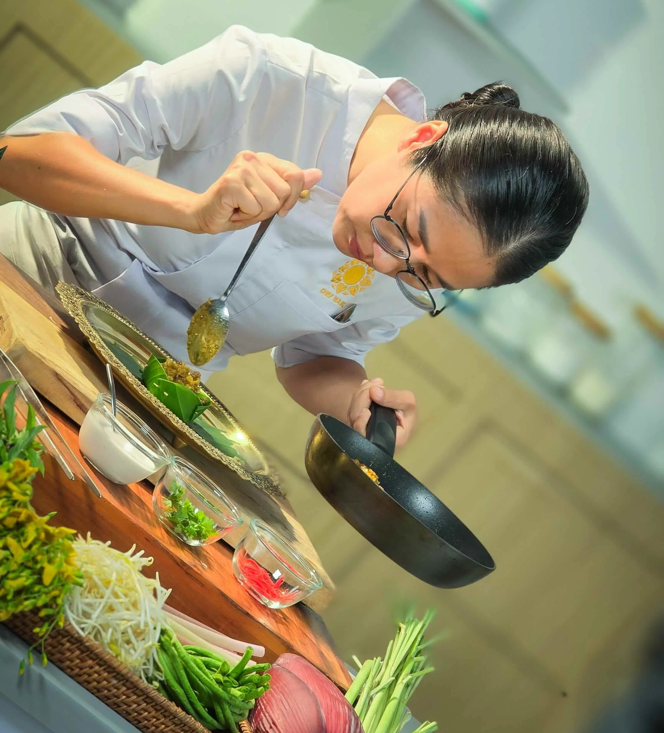 Chef Nak preparing traditional Cambodian cuisine.