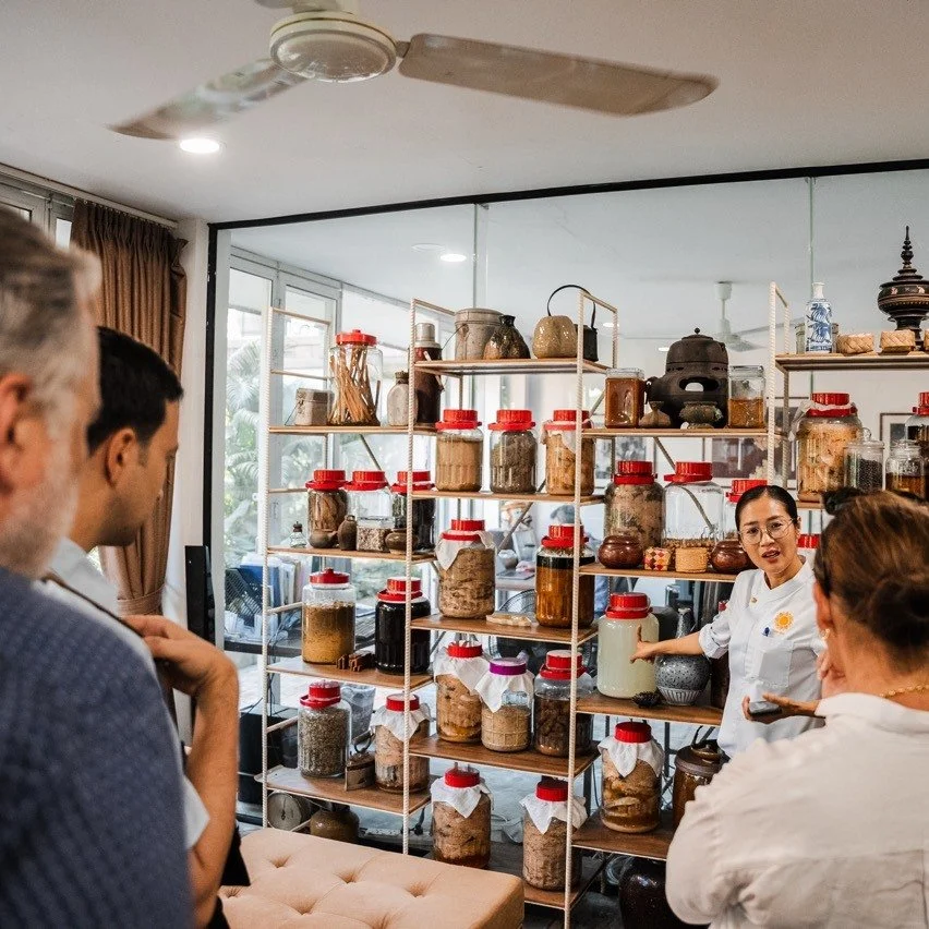 Chef Nak introducing guests to traditional Cambodian ingredients during a culinary experience