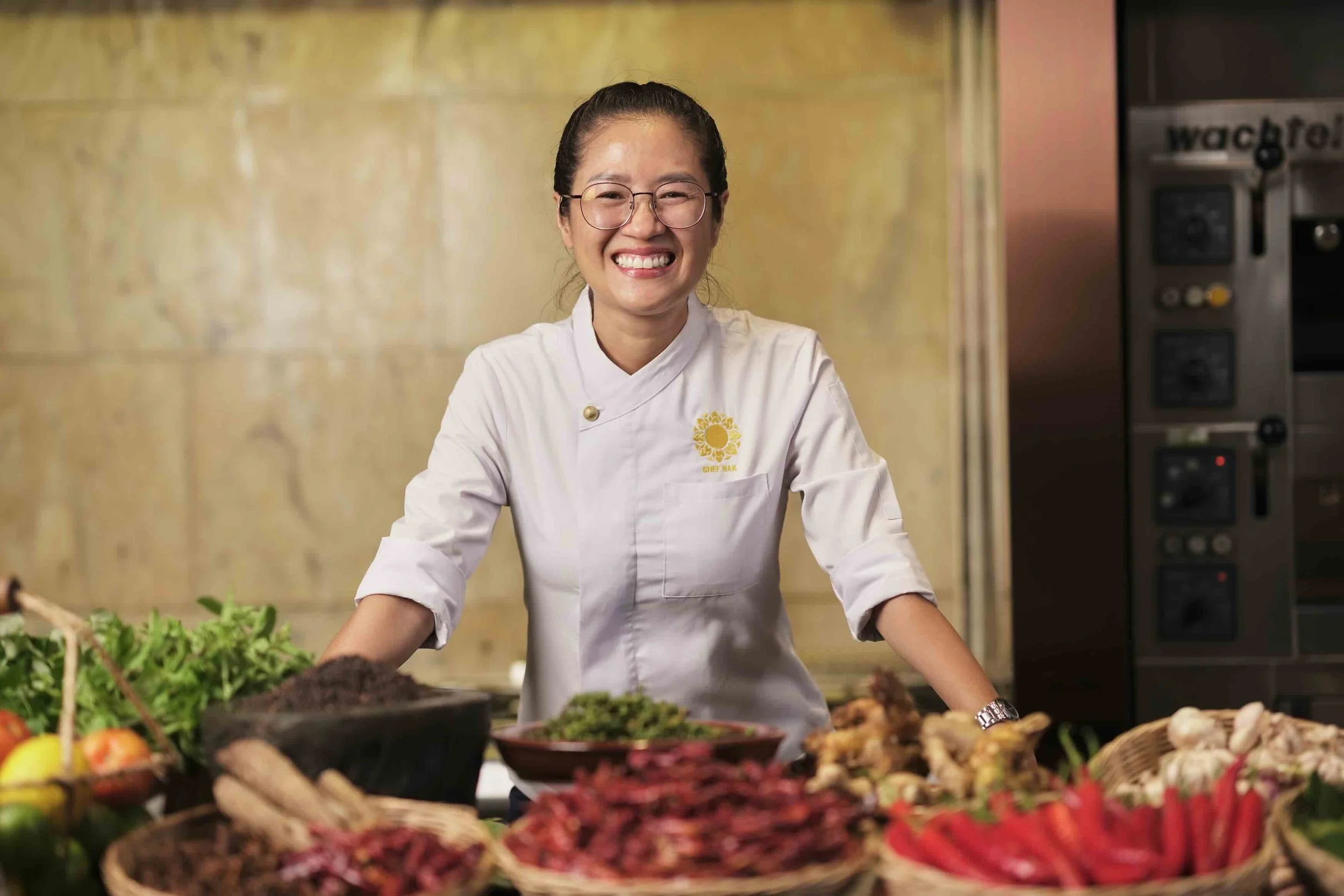 Chef Nak showcasing fresh, locally sourced Cambodian ingredients used in traditional Cambodian cuisine.