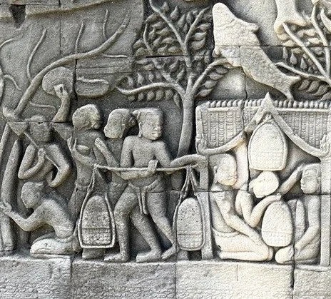 Ancient stone carving depicting Cambodian livelihood at Bayon Temple in Cambodia