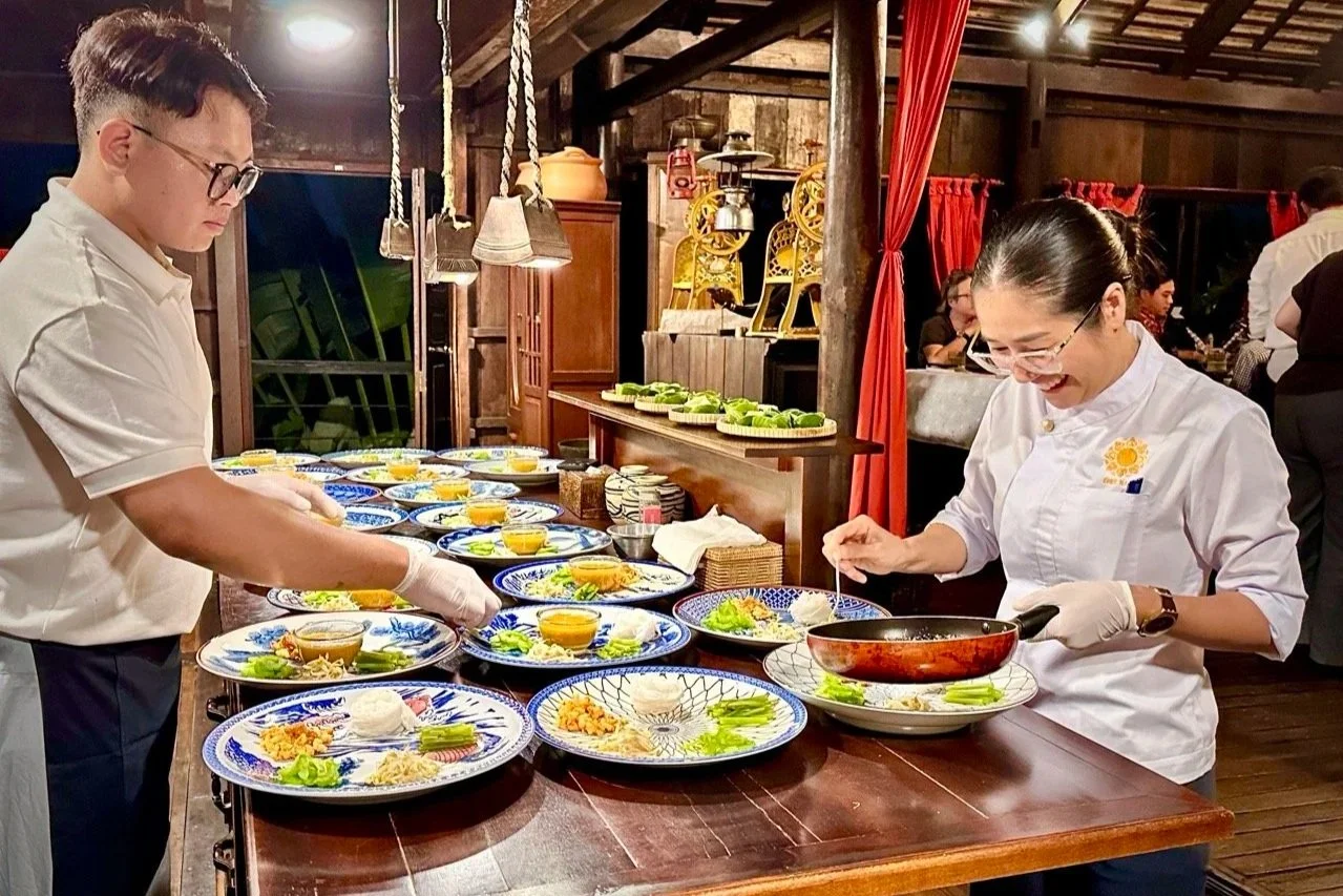 Chef Nak preparing handcrafted Cambodian dishes for guests during her intimate private home dining experience.