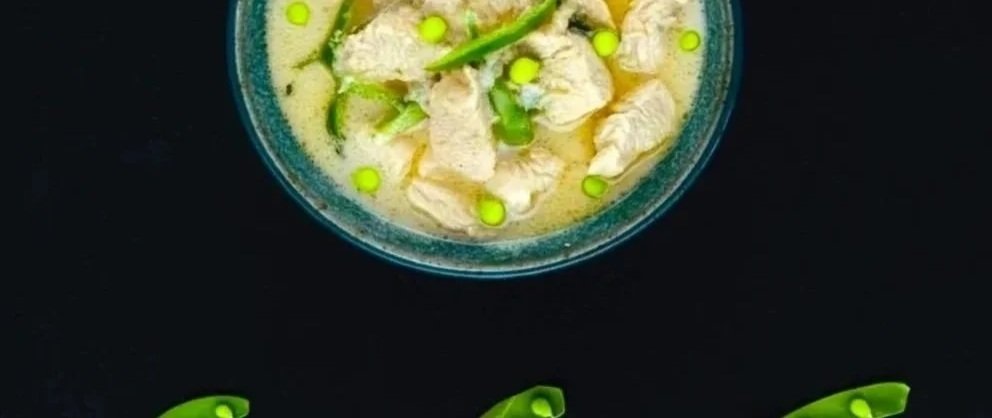 Chicken Emerald Soup (Samlor Morokot) from Chef Nak’s SAOY cookbook—Cambodian coconut chicken soup with snow peas, kaffir lime, and Khmer basil.