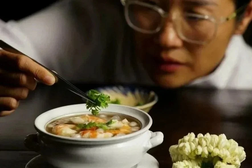 Chef Nak preparing a royal cuisine for her home dining guests in Siem Reap