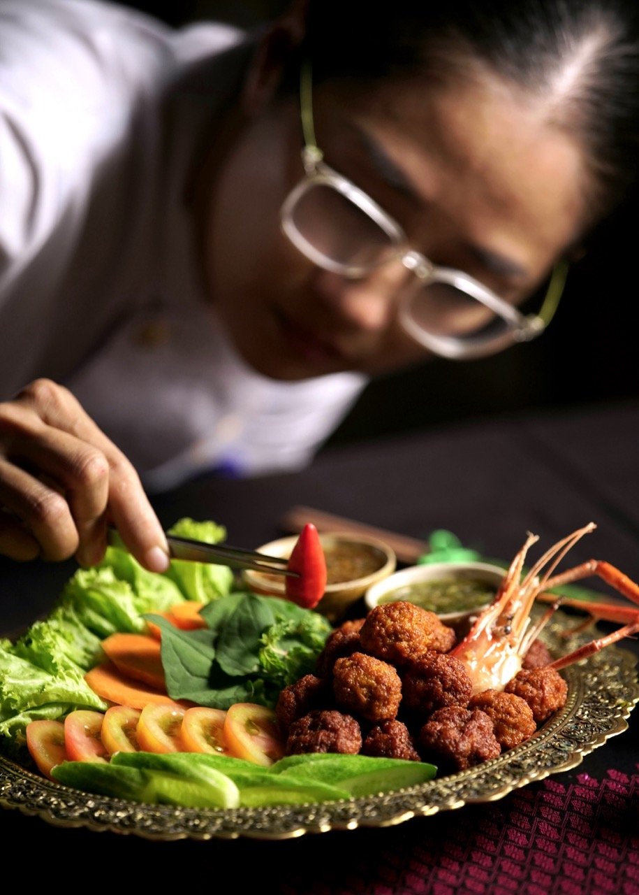 Chef Nak preparing a Cambodian meatball made with prawn paste