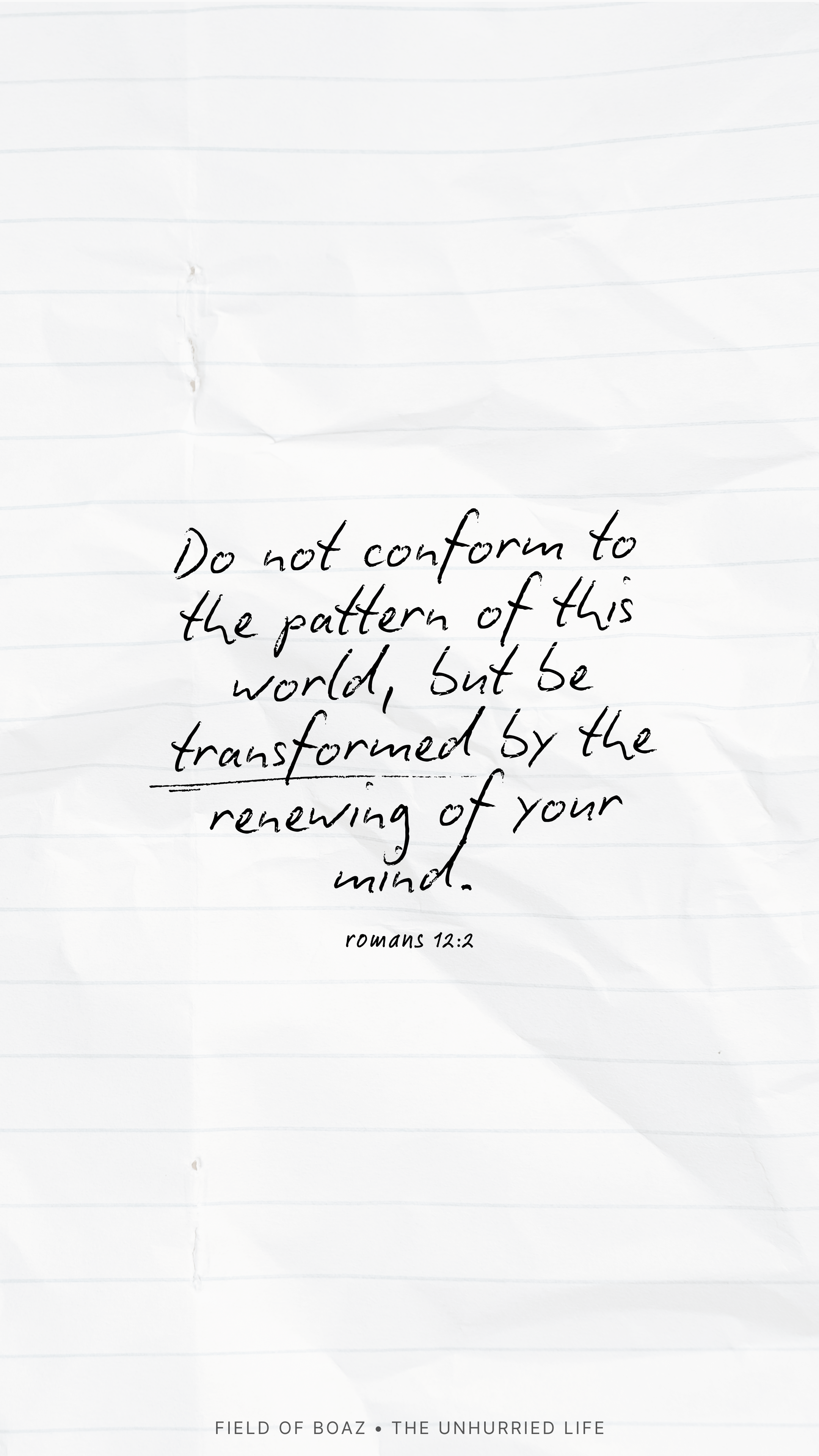 Handwritten quote on crumpled white notebook paper that says, 'Do not conform to the pattern of this world, but be transformed by the renewing of your mind. Romans 12:2.'