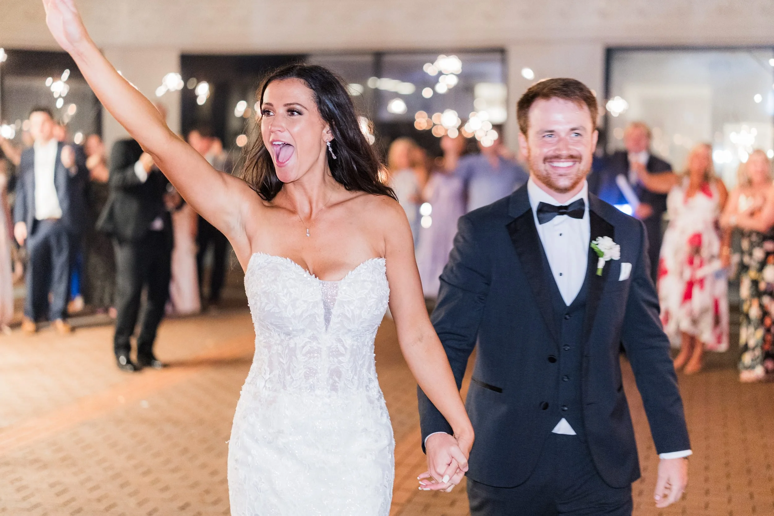 36-westin-poinsett-wedding-sparkler-exit-cheer.jpg