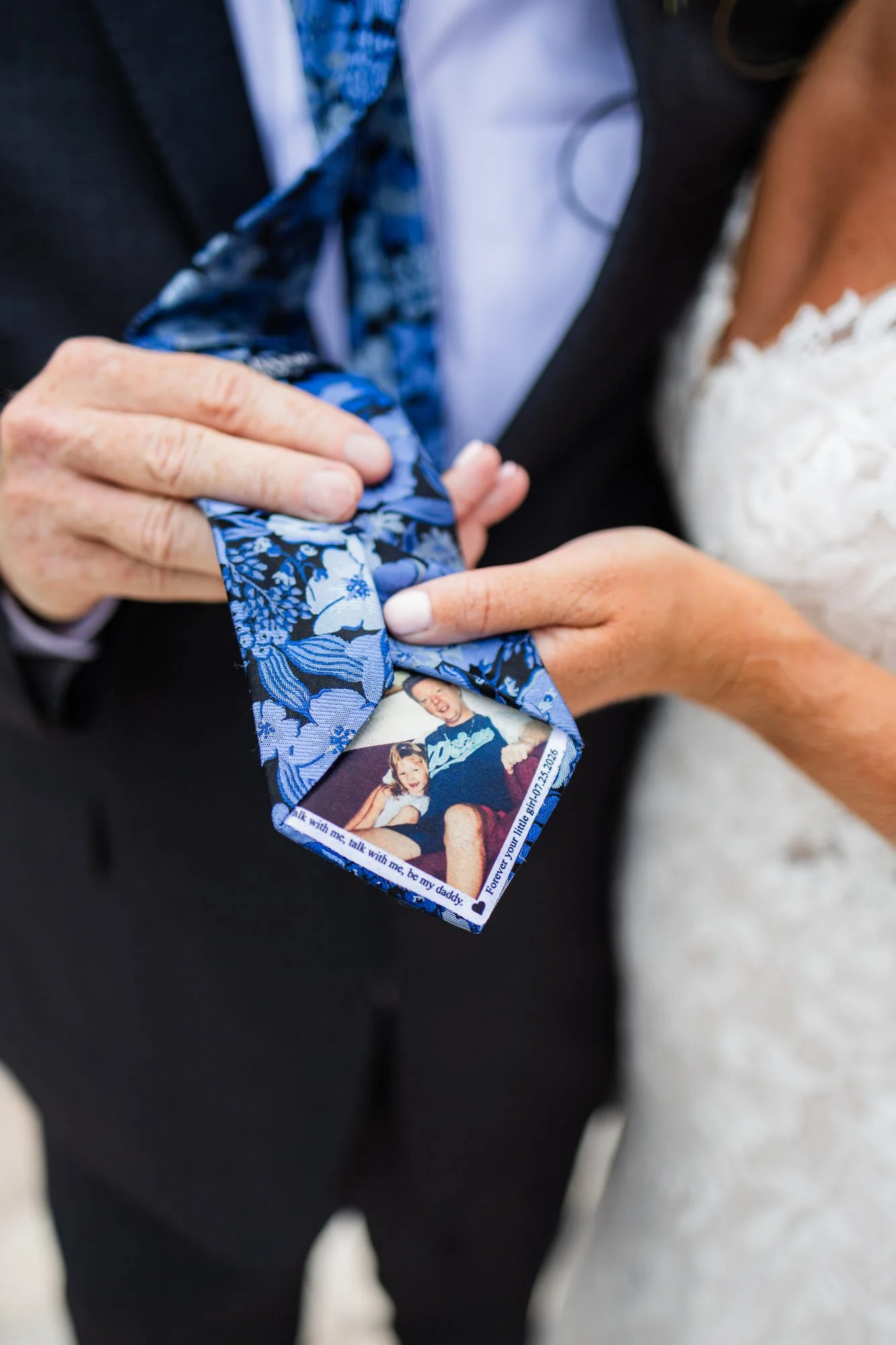 Father of the bride's tie with a childhood photo of the bride sewn inside