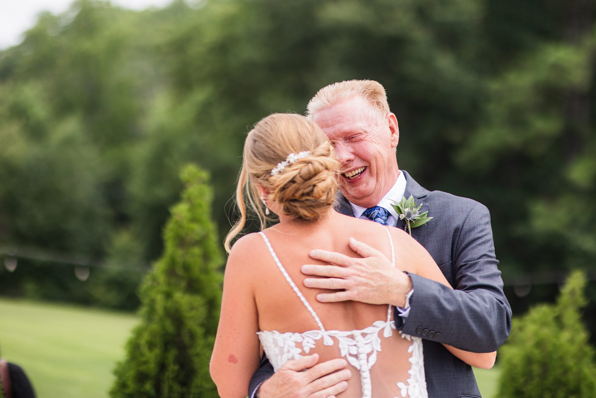 Father of the bride in tears during the first look at a Greenbrier Farms wedding in Easley, SC