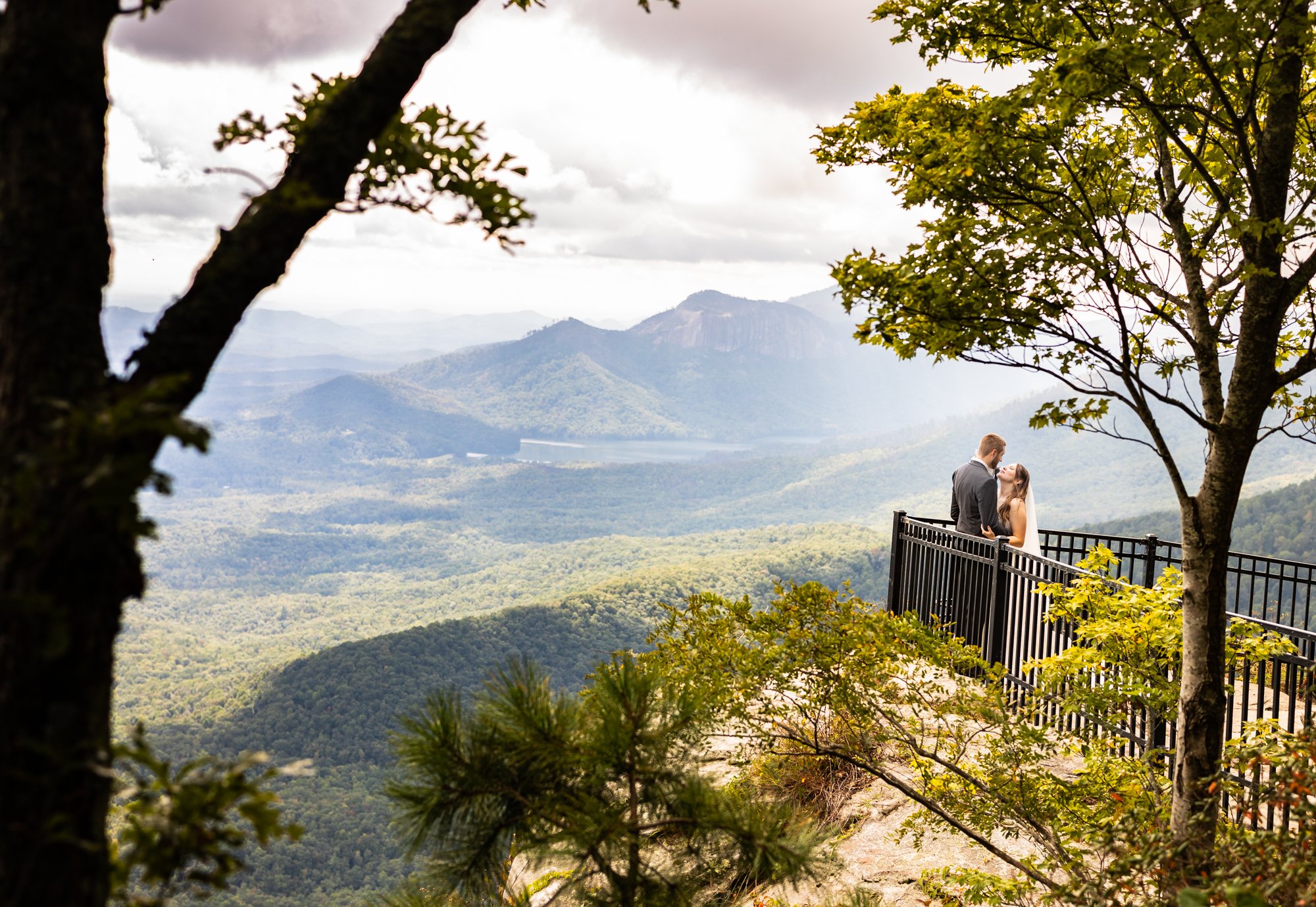 photo of newly weds sharing a romantic moment after the ceremony overlooking Caesar's Head State Park