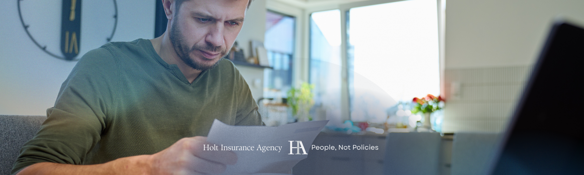 Man Looking Insurance Documents in Brentwood