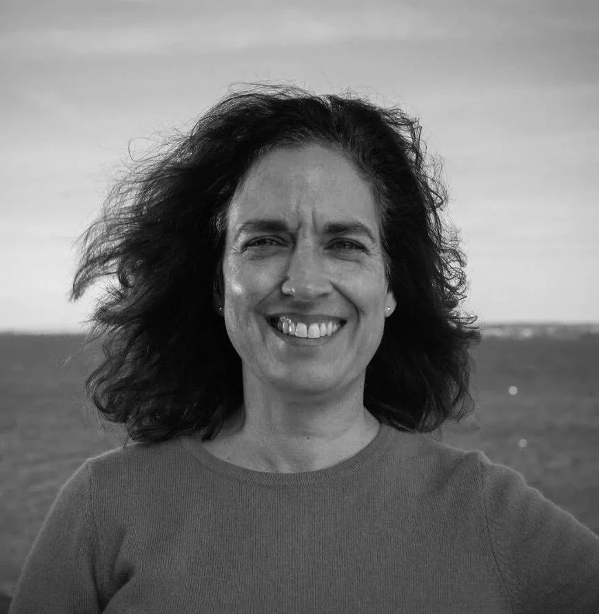 Sue Kennedy, Communications Specialist, with ocean in background.