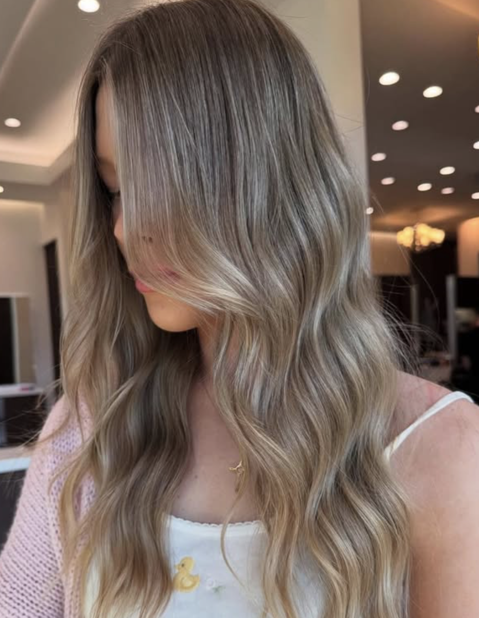 Custom balayage hair color by Tangerine Salon Aveda colorists showing sun-kissed dimensional blonde