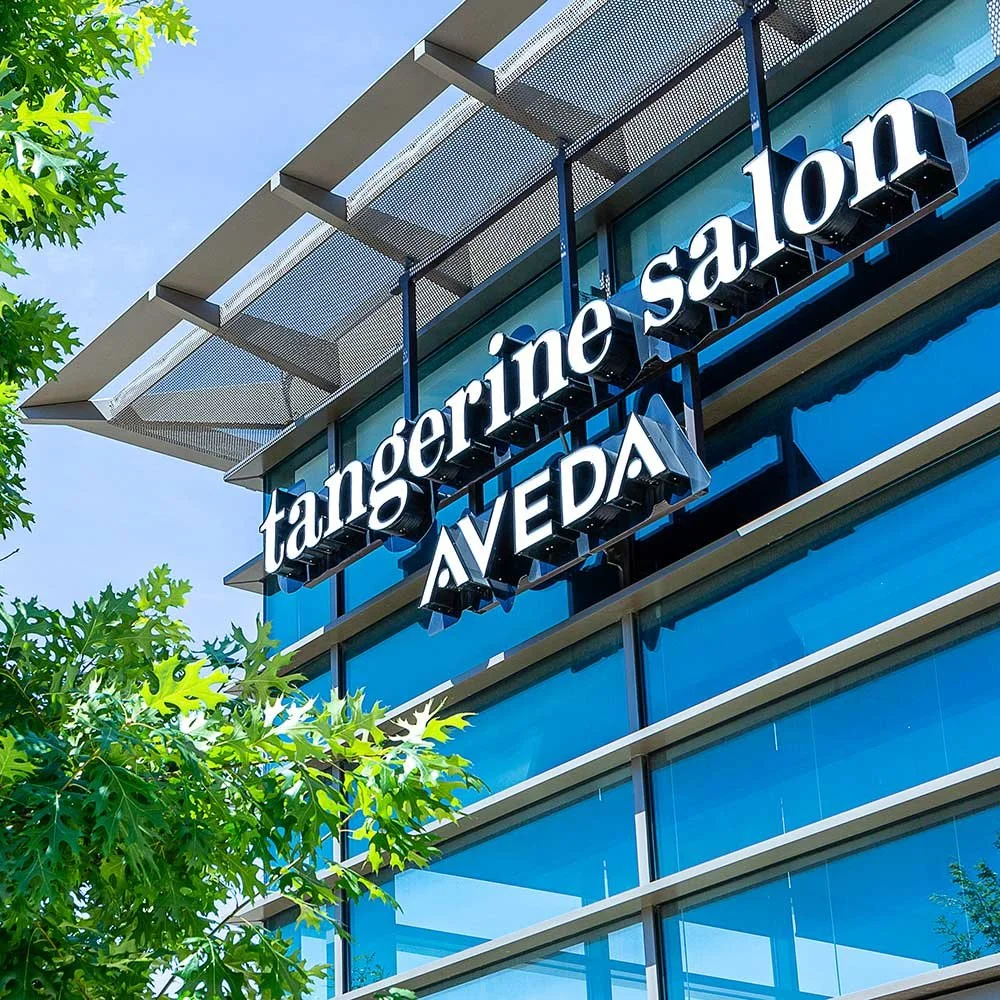Tangerine Salon Dallas exterior featuring Aveda signage