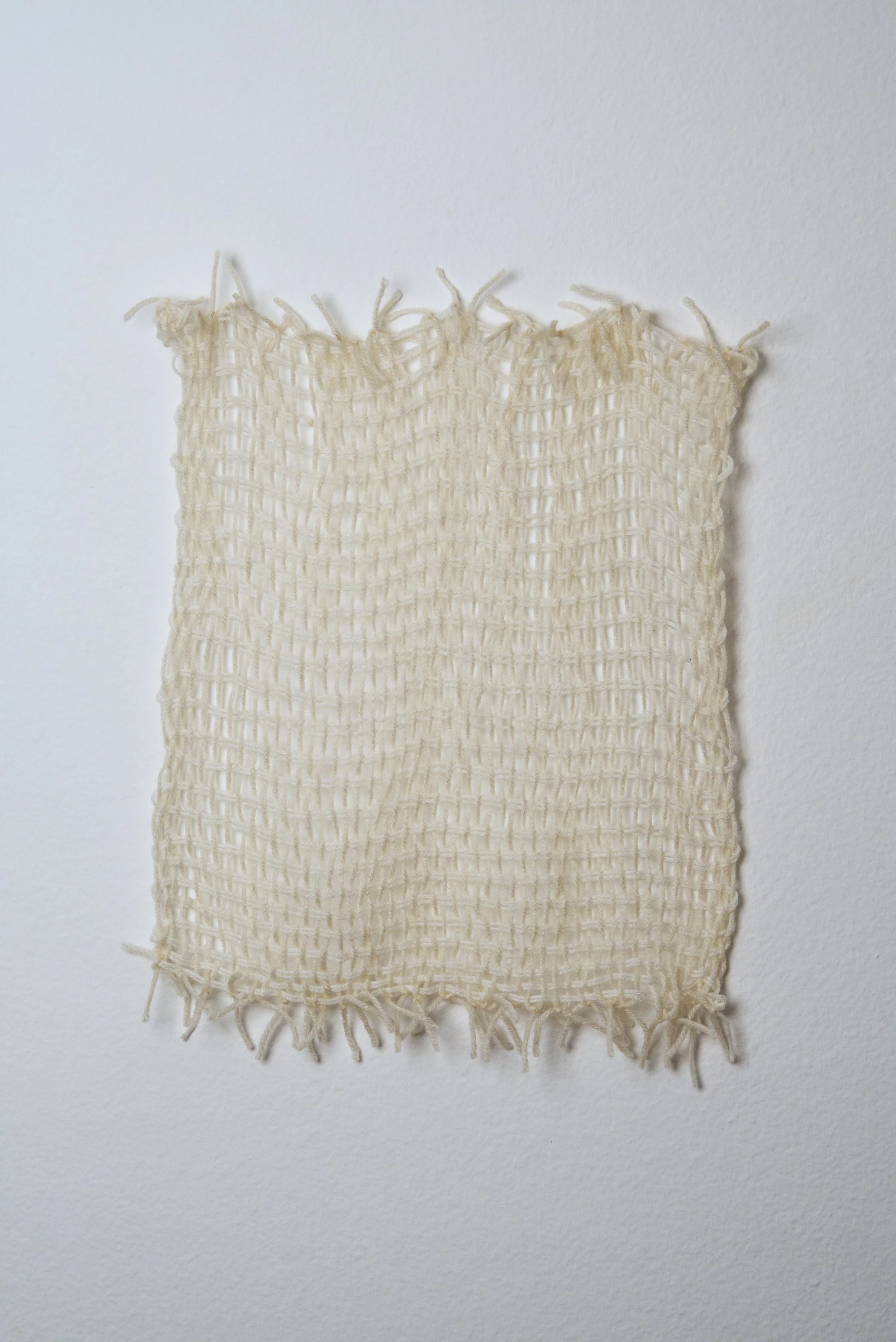 Relatively Permanent 3/52 
approximately 14" x 18",   yarn, 2024. 
