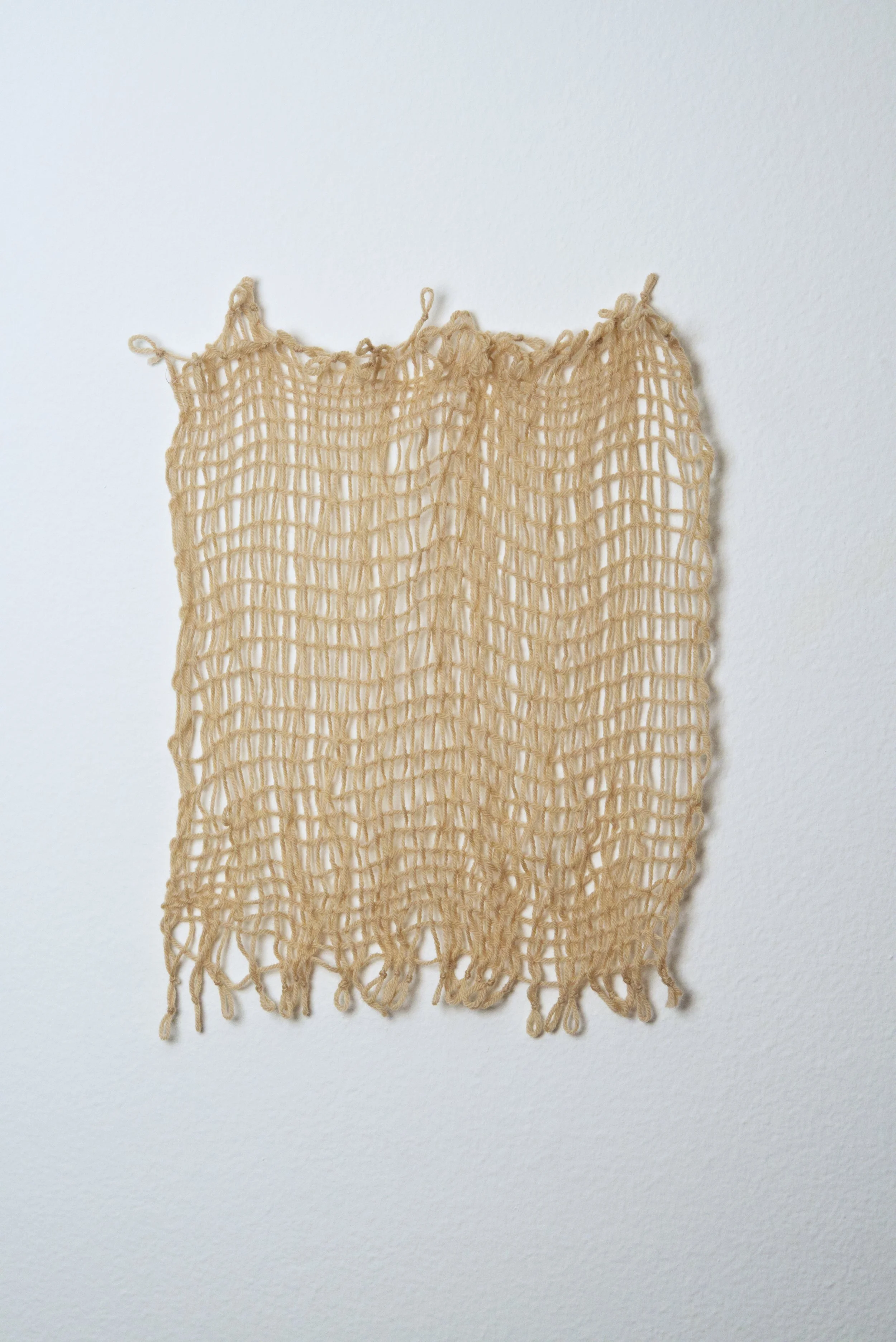 Relatively Permanent 35/52 
approximately 14" x 18",   yarn, 2024. 