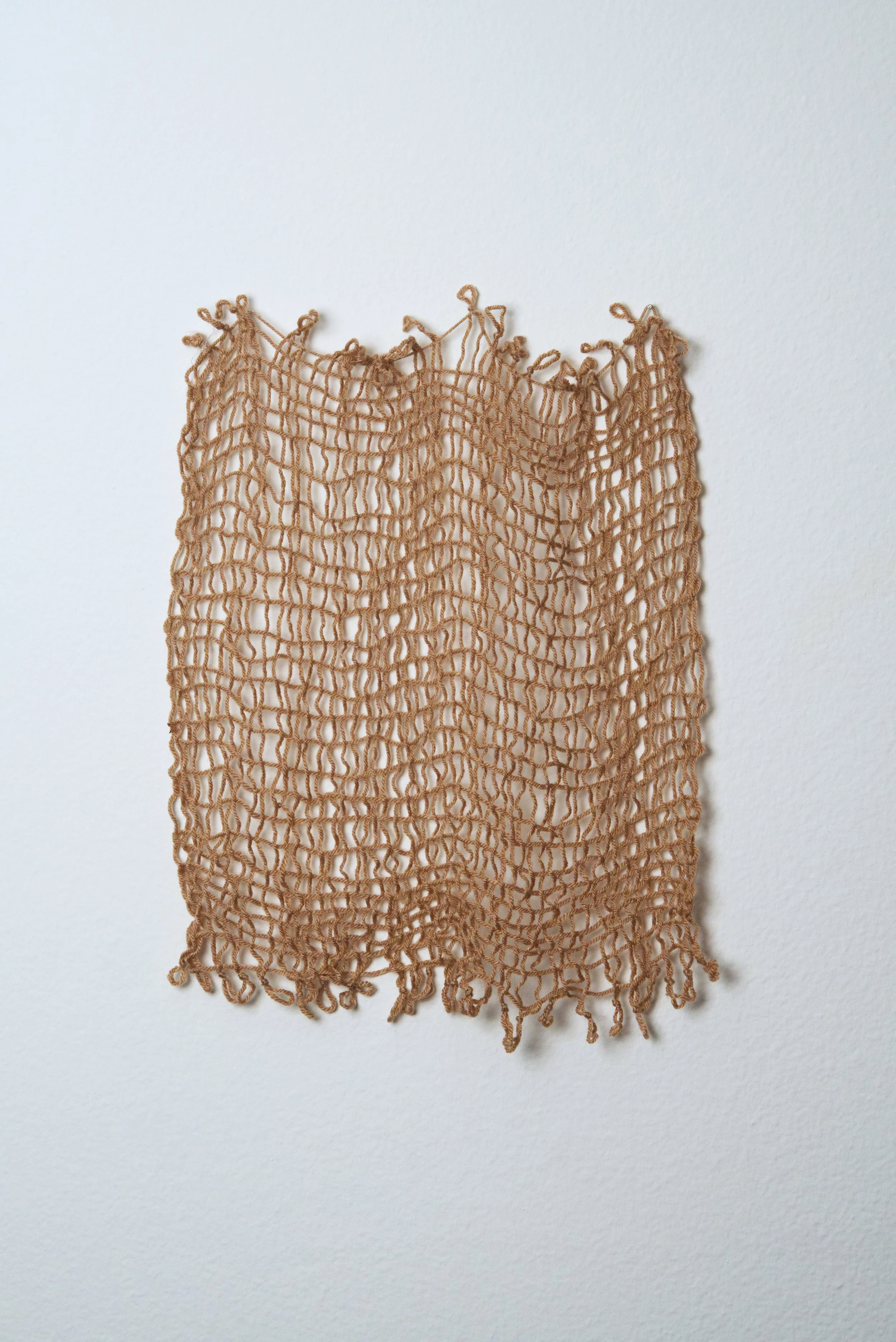 Relatively Permanent 32/52 
approximately 14" x 18",   yarn, 2024. 
