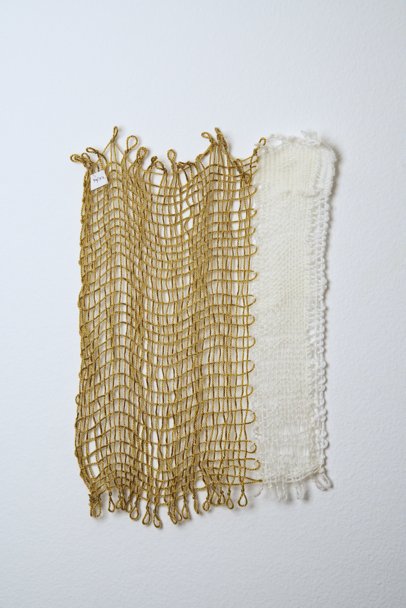 Neutral shades of white, tan, gold, brown, black and orange yarn to provide a visual record of the shift in feelings from week to week over the course of one year.