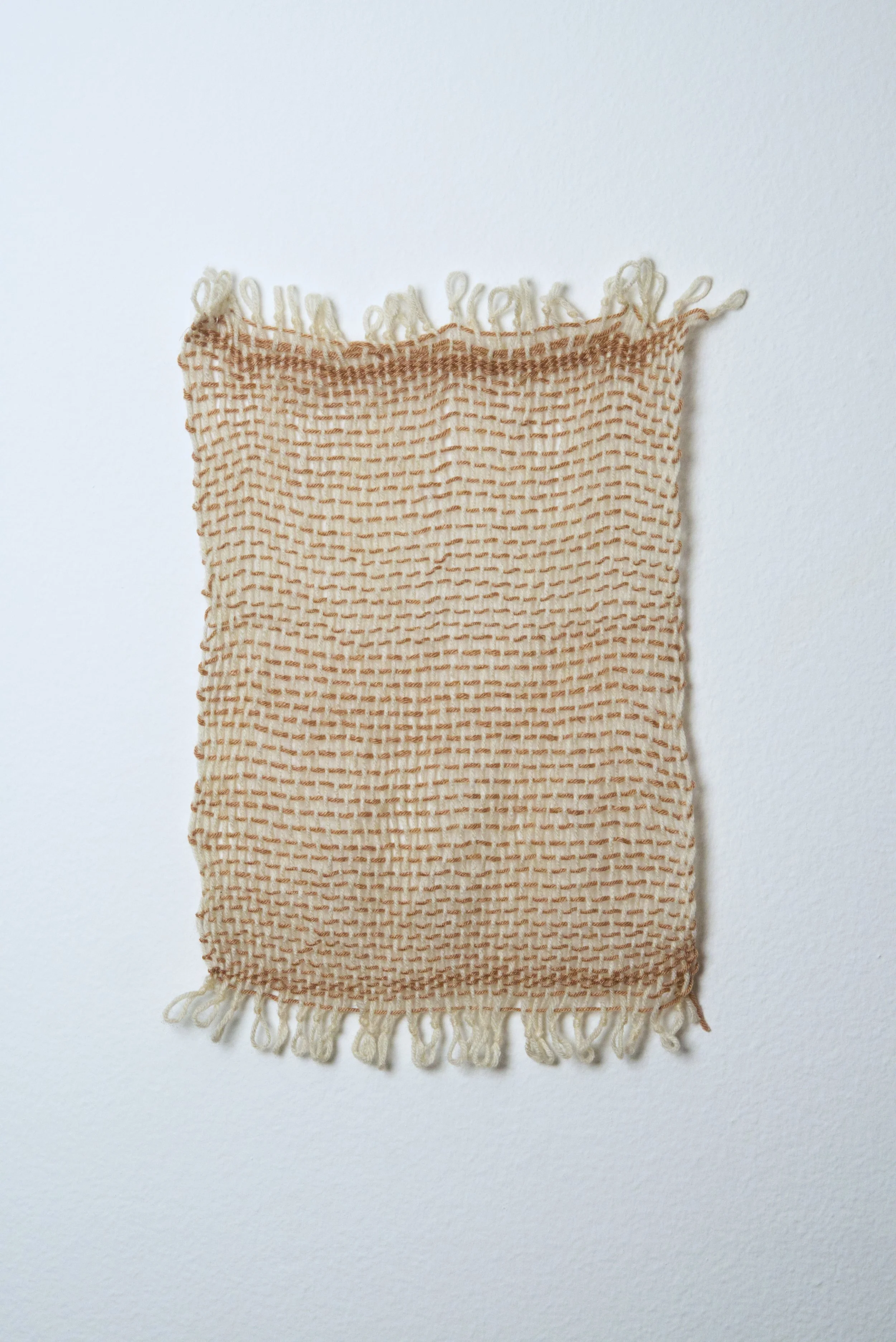 Relatively Permanent 5/52 
approximately 14" x 18",   yarn, 2024. 