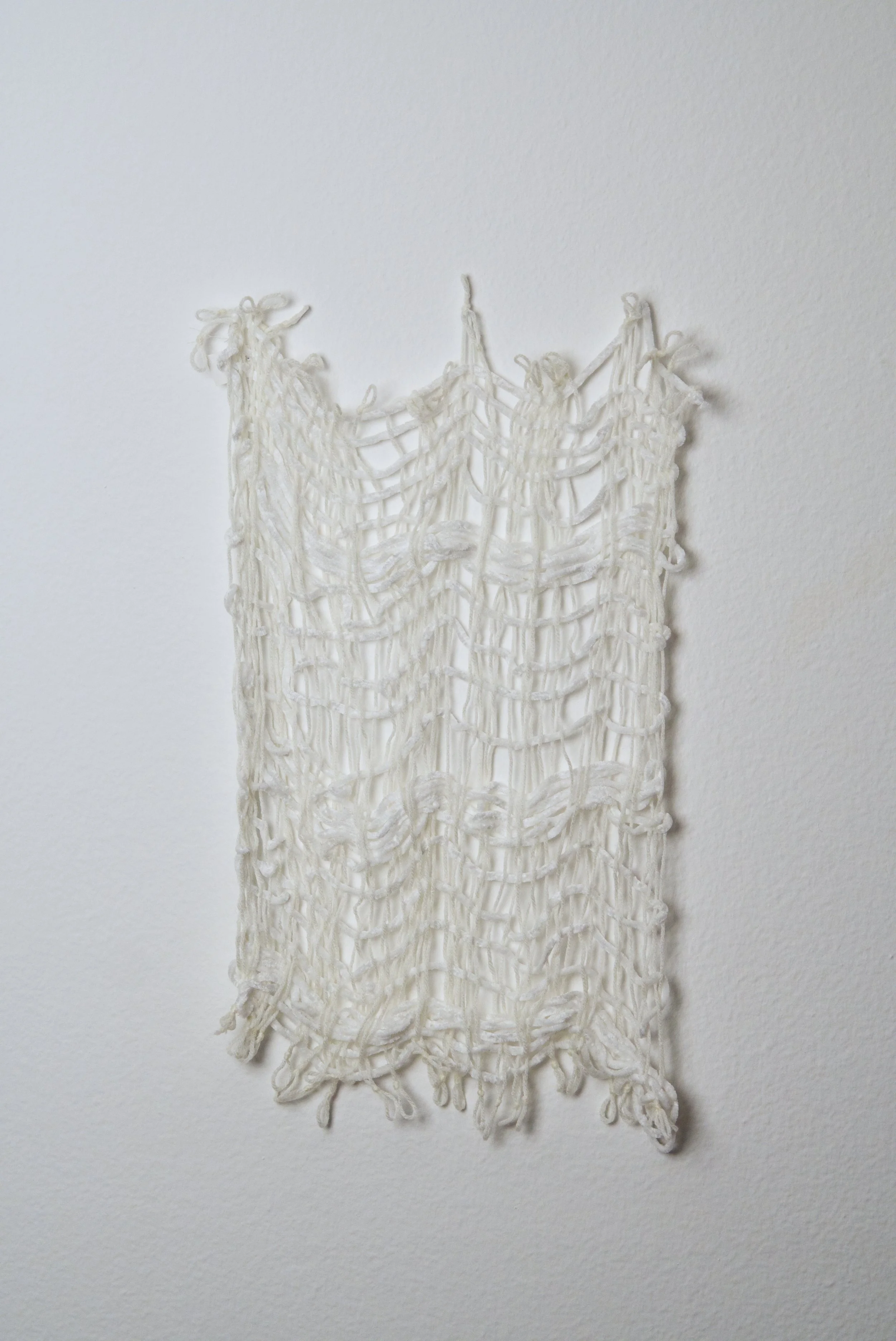 Relatively Permanent 33/52 
approximately 14" x 18",   yarn, 2024. 