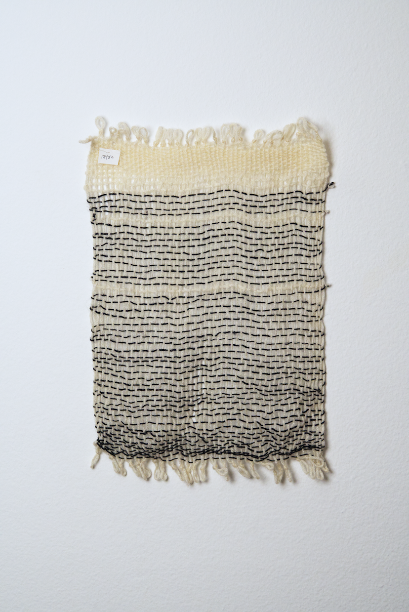 Neutral shades of white, tan, gold, brown, black and orange yarn to provide a visual record of the shift in feelings from week to week over the course of one year.