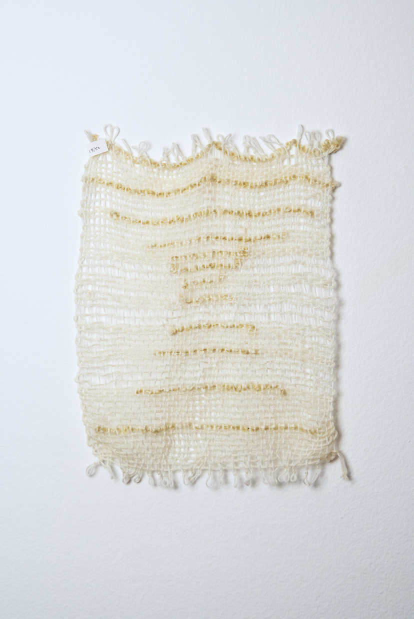 Neutral shades of white, tan, gold, brown, black and orange yarn to provide a visual record of the shift in feelings from week to week over the course of one year.