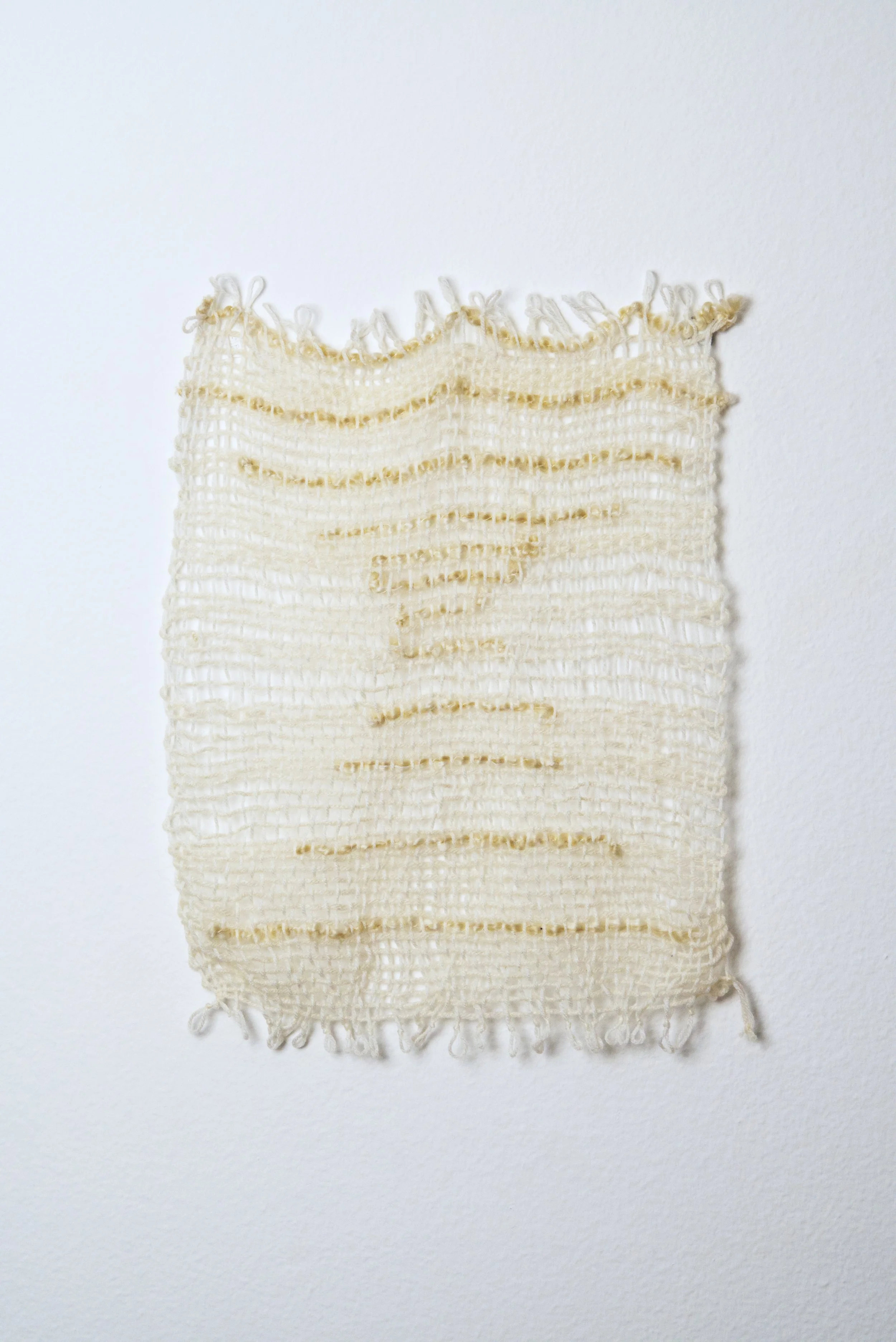 Relatively Permanent 19/52 
approximately 14" x 18",   yarn, 2024. 