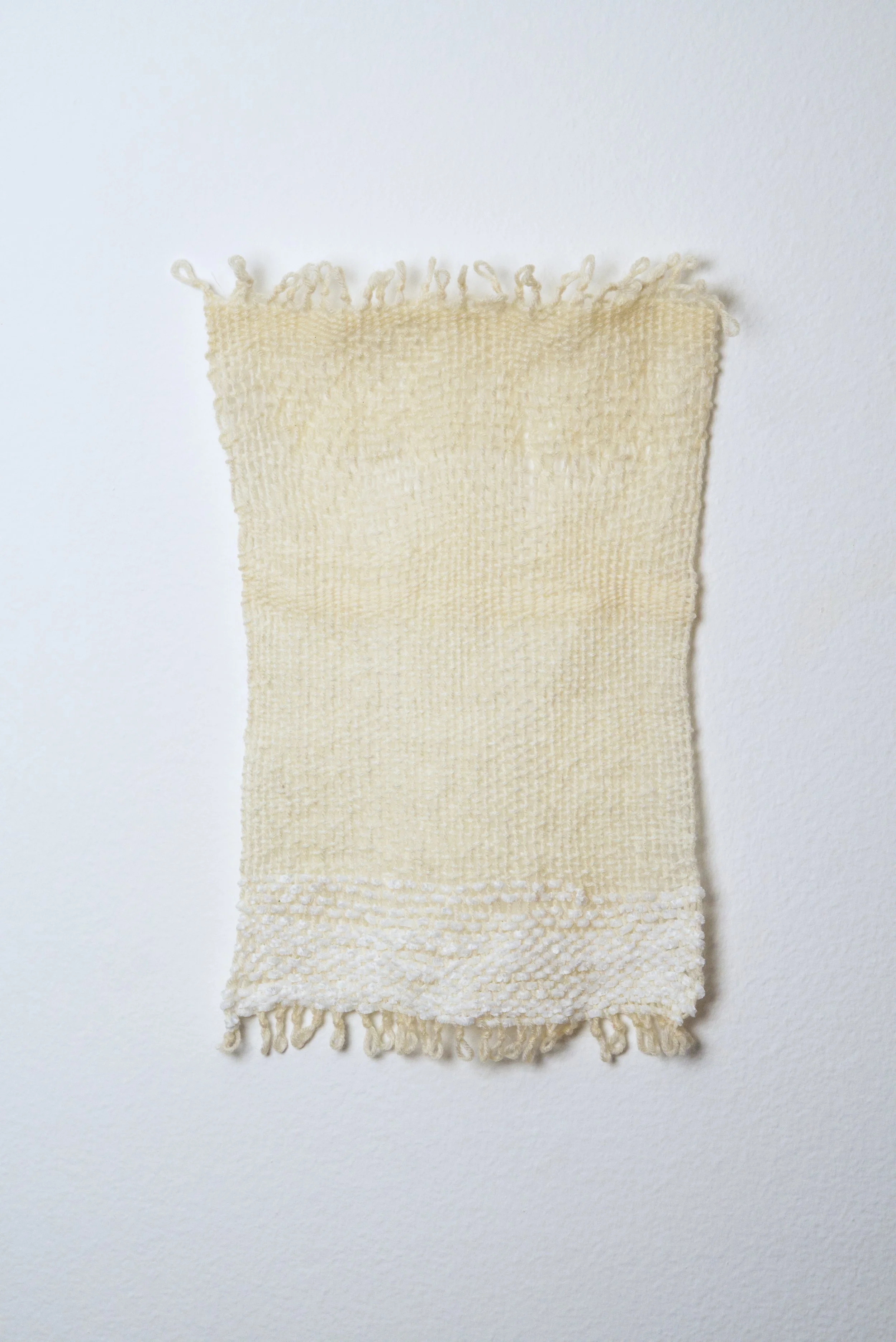 Relatively Permanent 51/52 
approximately 14" x 18",   yarn, 2024. 