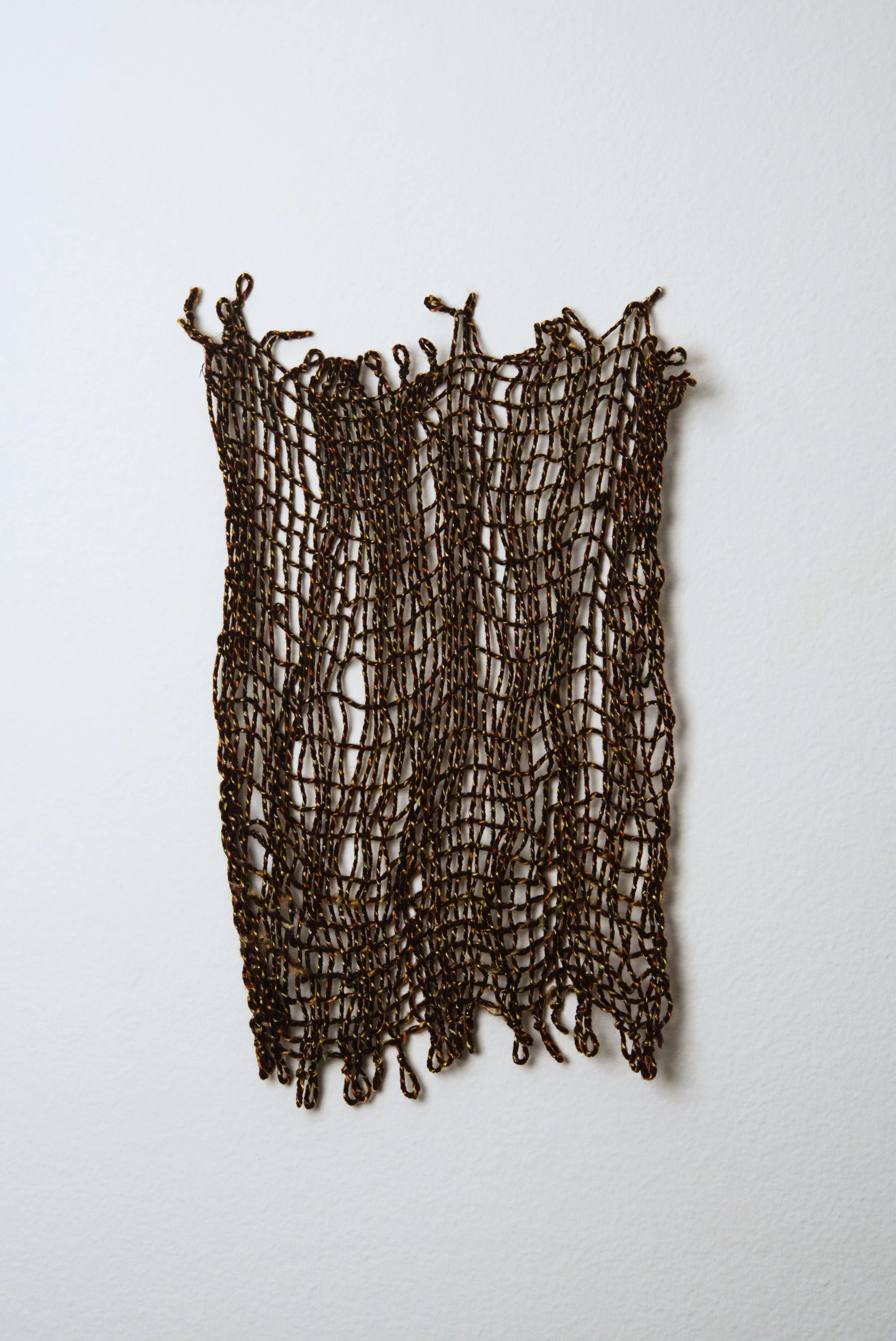 Relatively Permanent 21/52 
approximately 14" x 18",   yarn, 2024. 