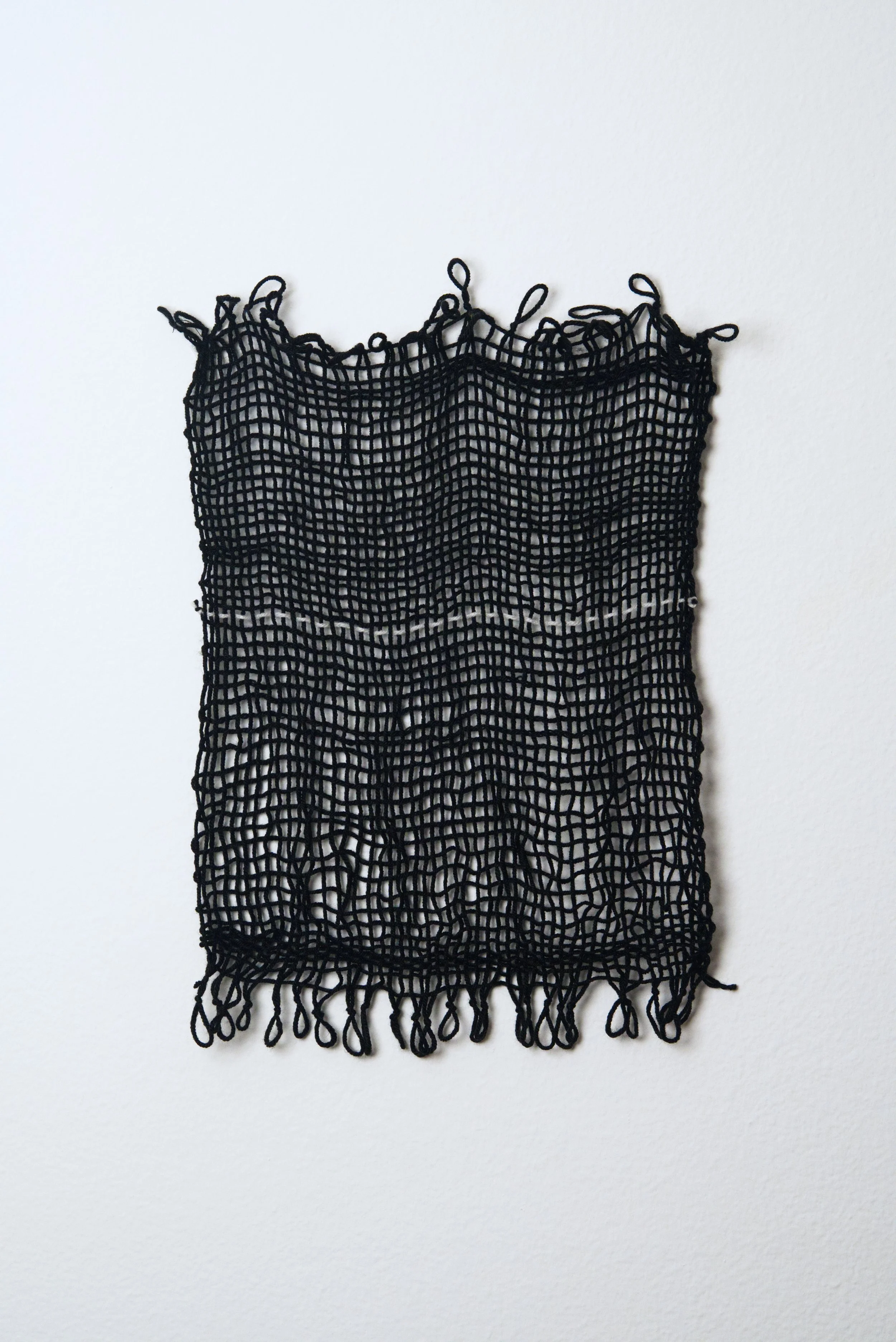 Relatively Permanent 16/52 
approximately 14" x 18",   yarn, 2024. 