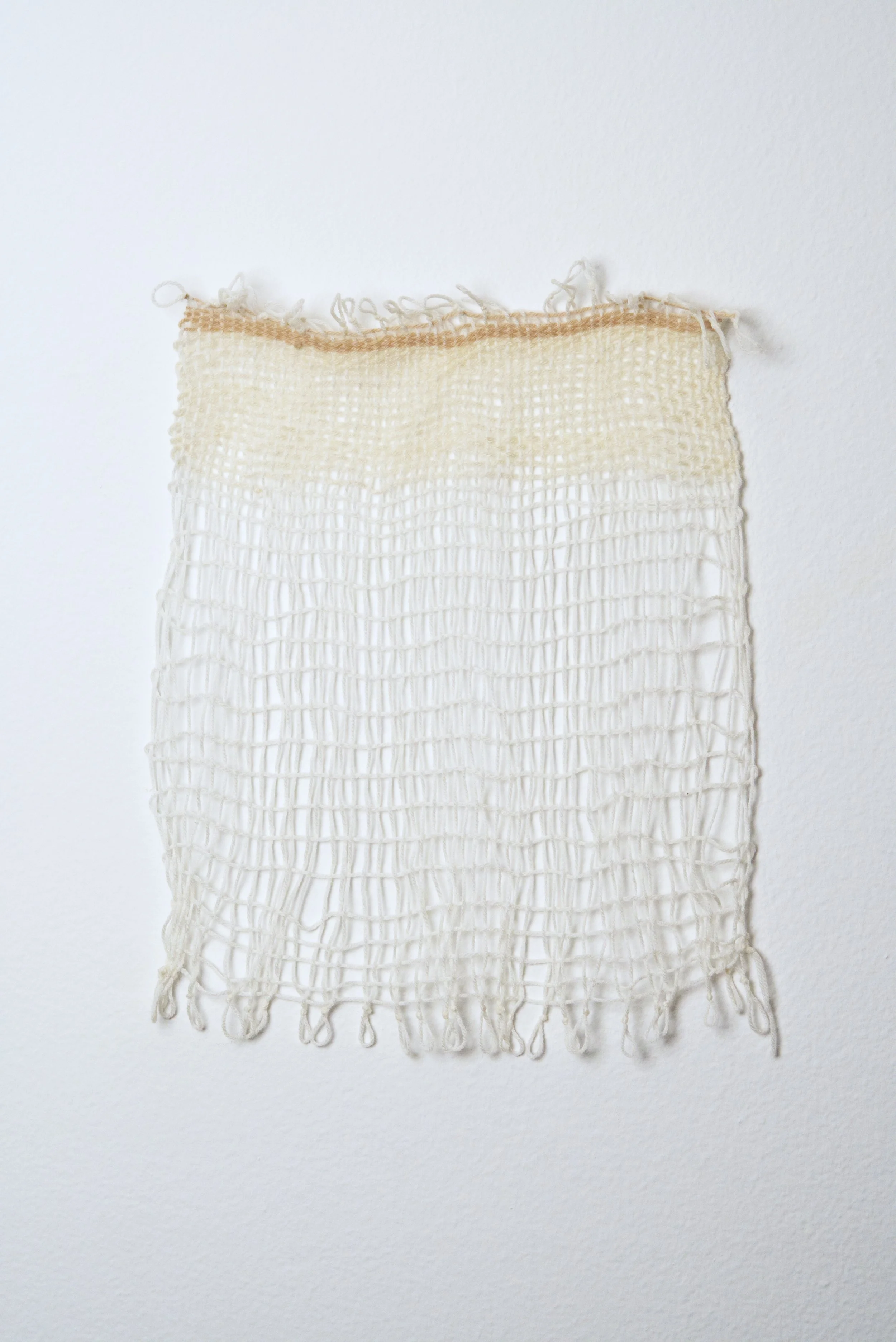 Relatively Permanent 12/52 
approximately 14" x 18",   yarn, 2024. 