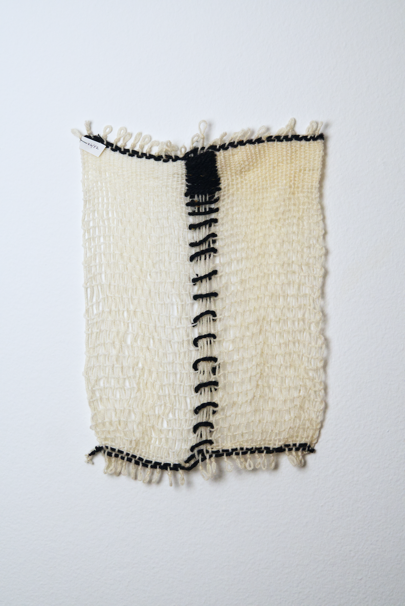 Neutral shades of white, tan, gold, brown, black and orange yarn to provide a visual record of the shift in feelings from week to week over the course of one year.