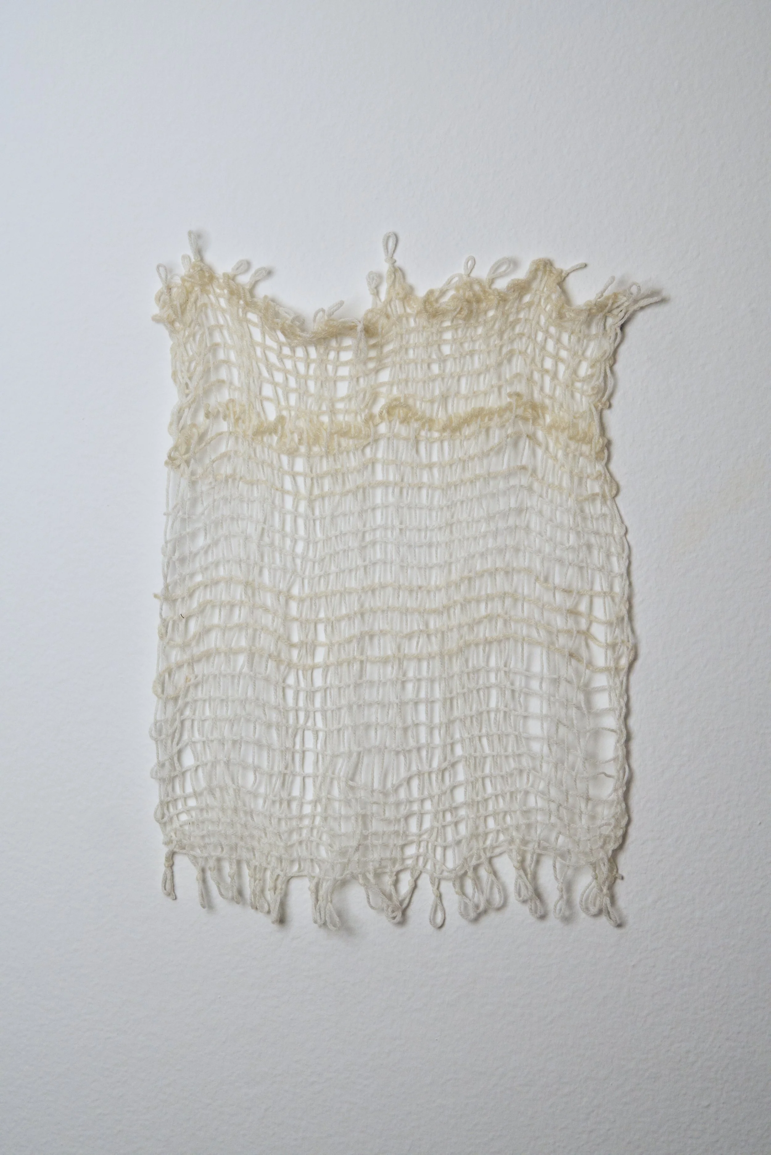 Relatively Permanent 22/52 
approximately 14" x 18",   yarn, 2024. 