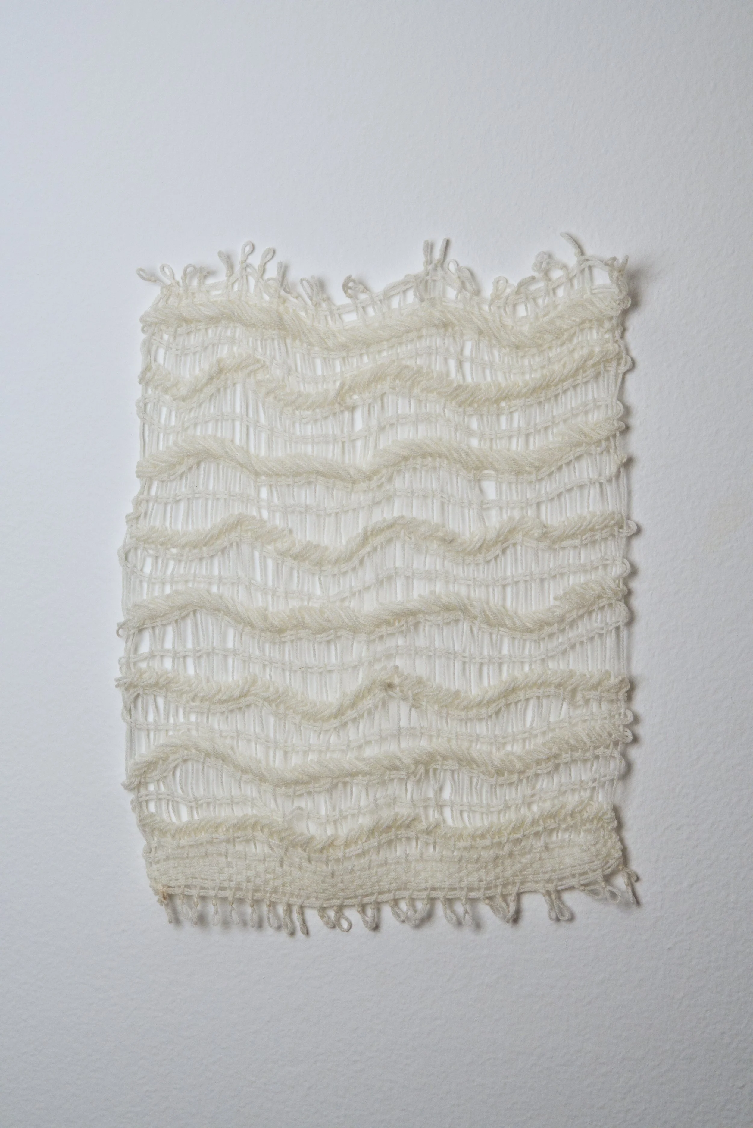 Relatively Permanent 29/52 
approximately 14" x 18",   yarn, 2024. 