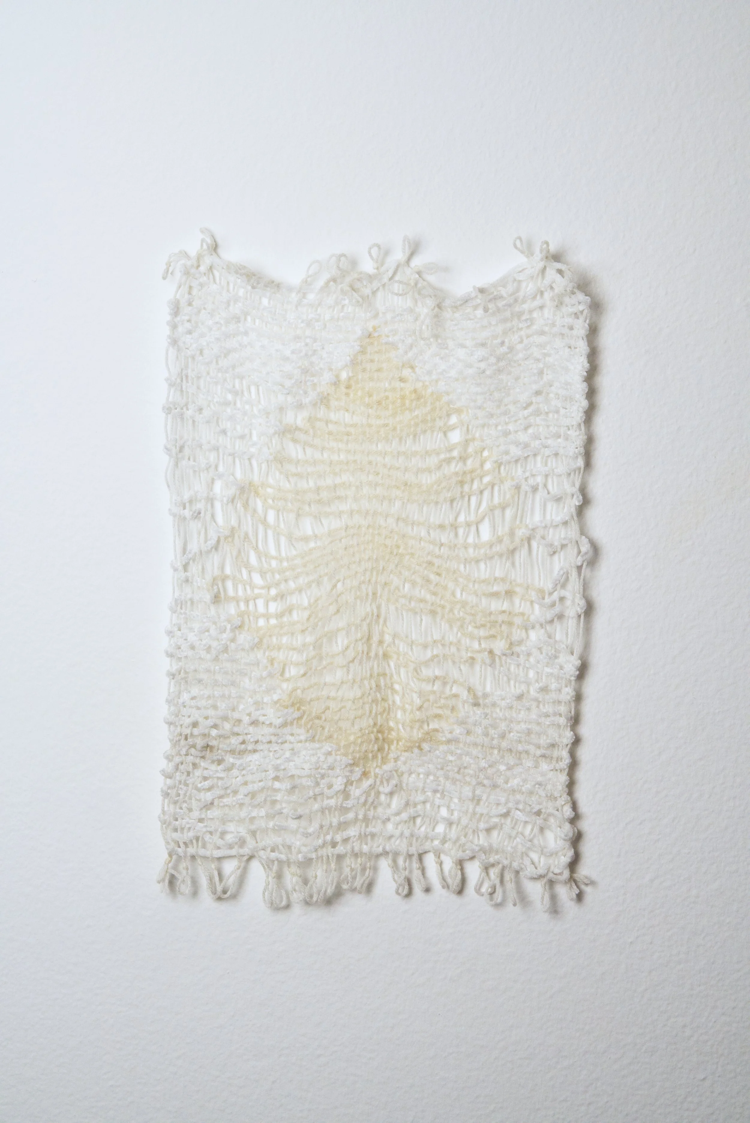 Relatively Permanent 46/52 
approximately 14" x 18",   yarn, 2024. 