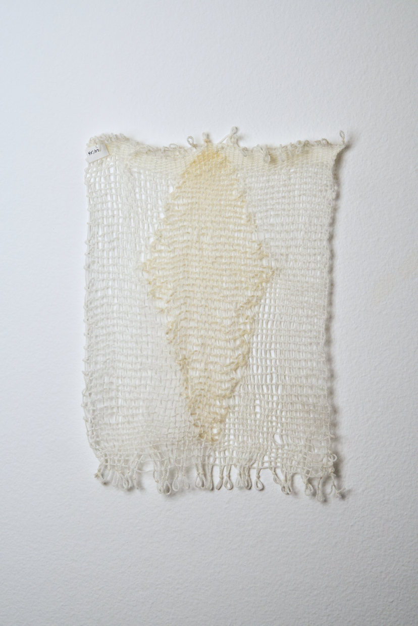 Neutral shades of white, tan, gold, brown, black and orange yarn to provide a visual record of the shift in feelings from week to week over the course of one year.