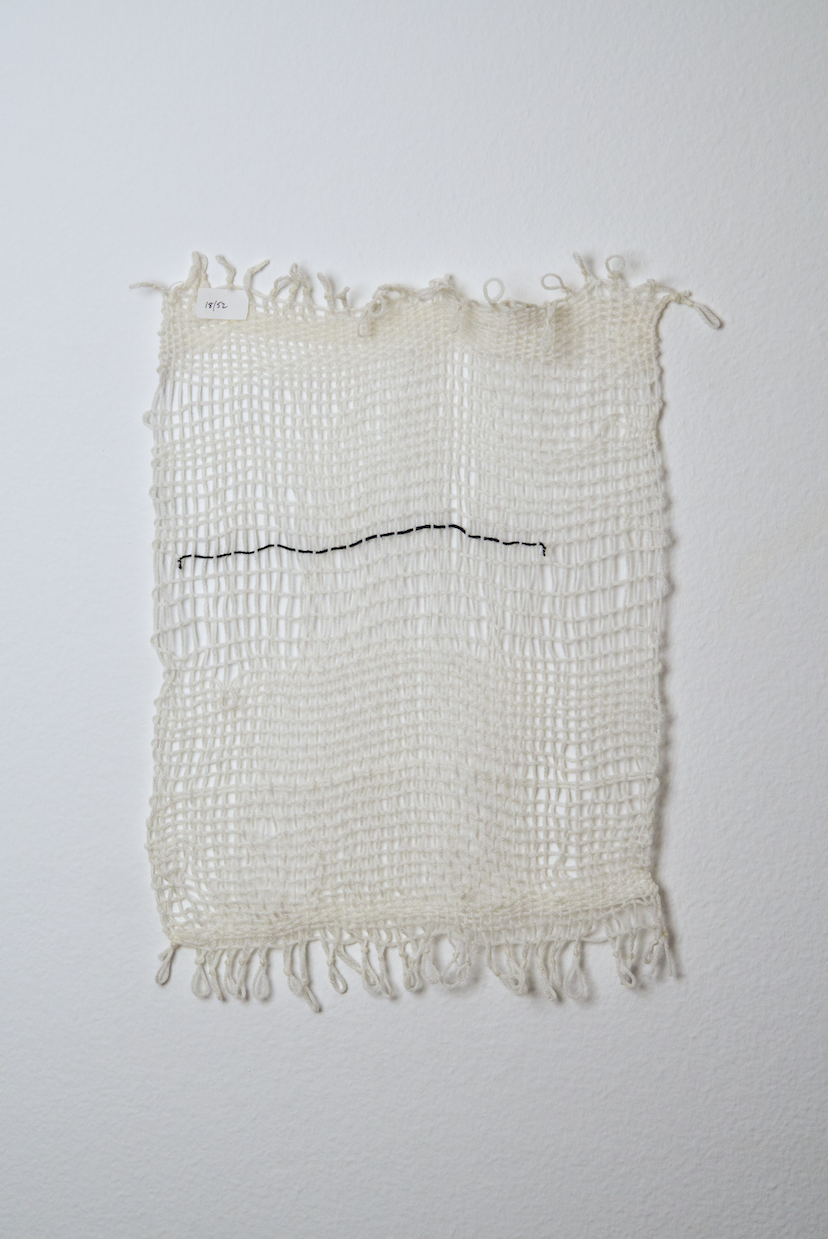 Neutral shades of white, tan, gold, brown, black and orange yarn to provide a visual record of the shift in feelings from week to week over the course of one year.