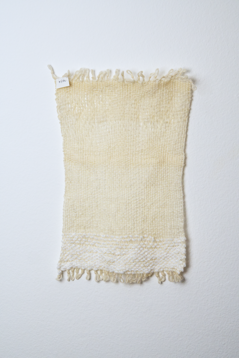 Neutral shades of white, tan, gold, brown, black and orange yarn to provide a visual record of the shift in feelings from week to week over the course of one year.