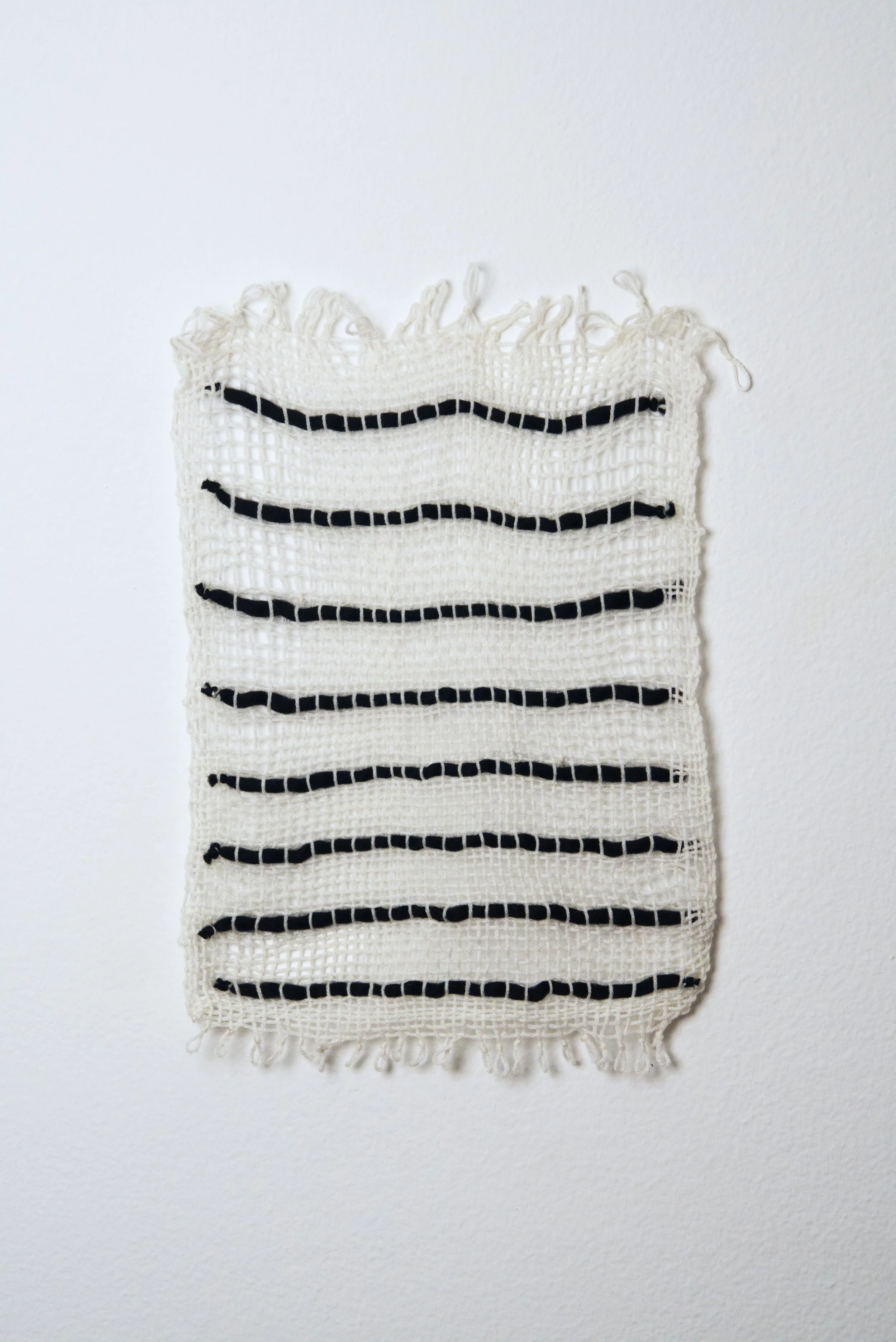 Relatively Permanent 10/52 
approximately 14" x 18",   yarn, 2024. 